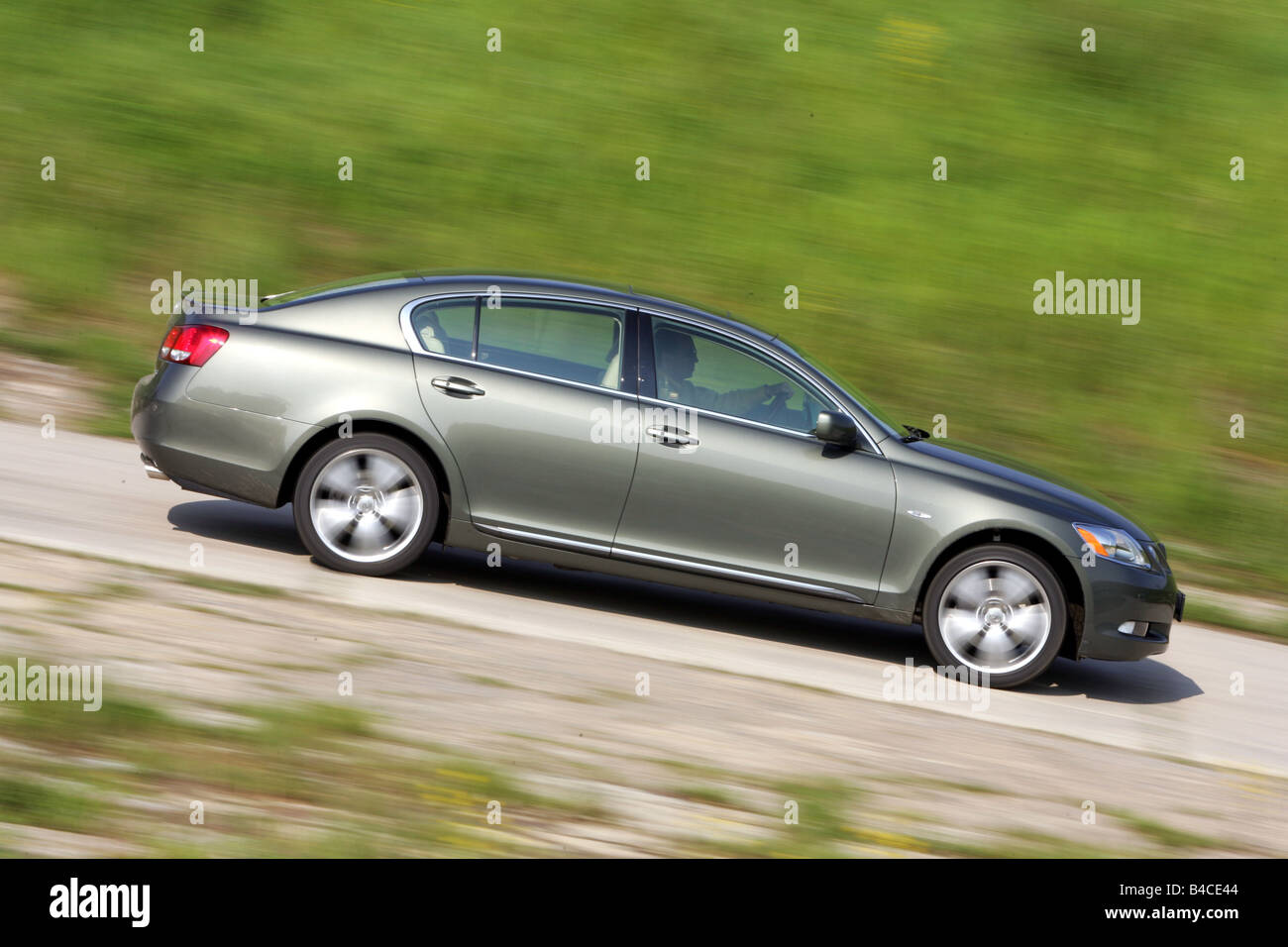 Car, Lexus GS 300, model year 2005-, silver-green, upper middle-sized , Limousine, driving, side view, country road, photographe Stock Photo