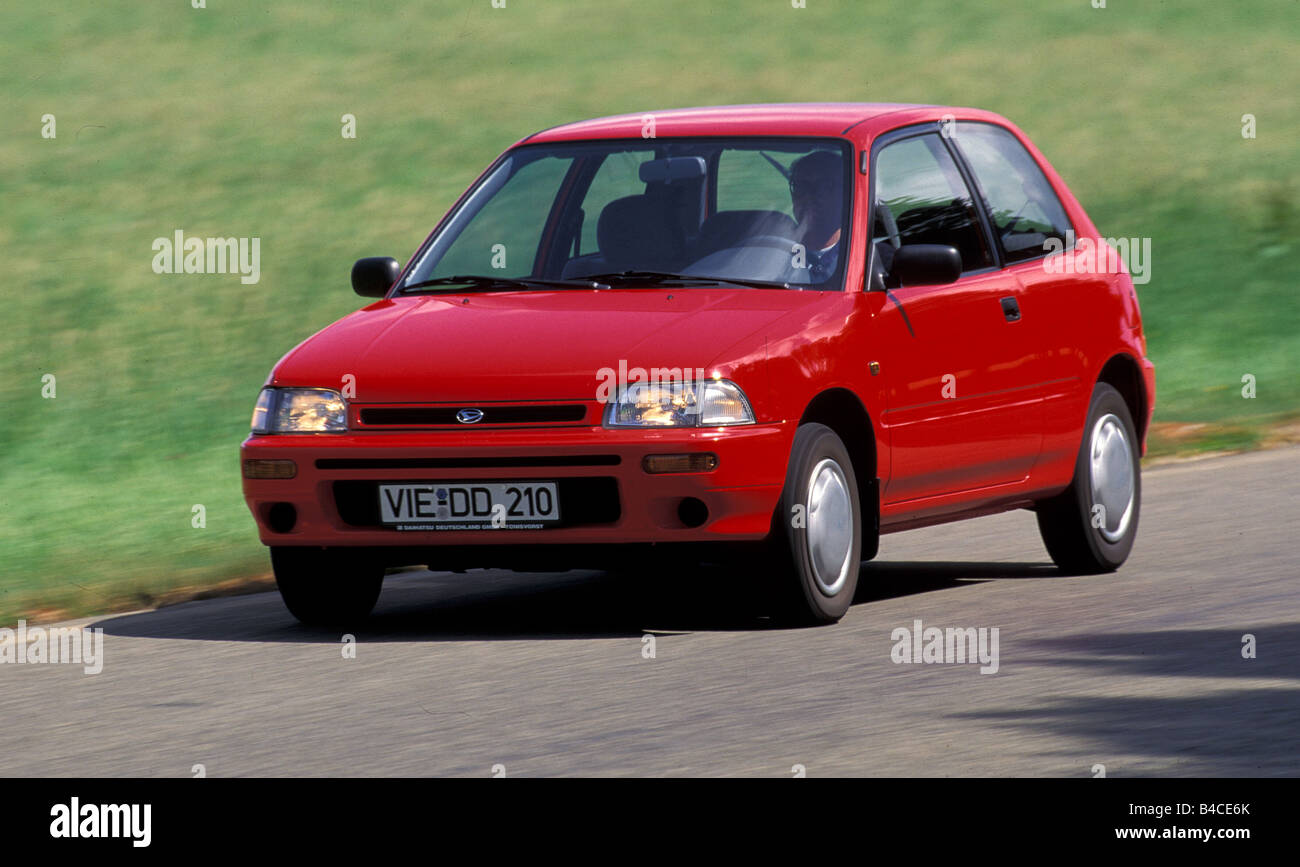 Car, Daihatsu Charade, model year 1993-, red, small approx., Limousine, driving, diagonal from the front, frontal view, country Stock Photo