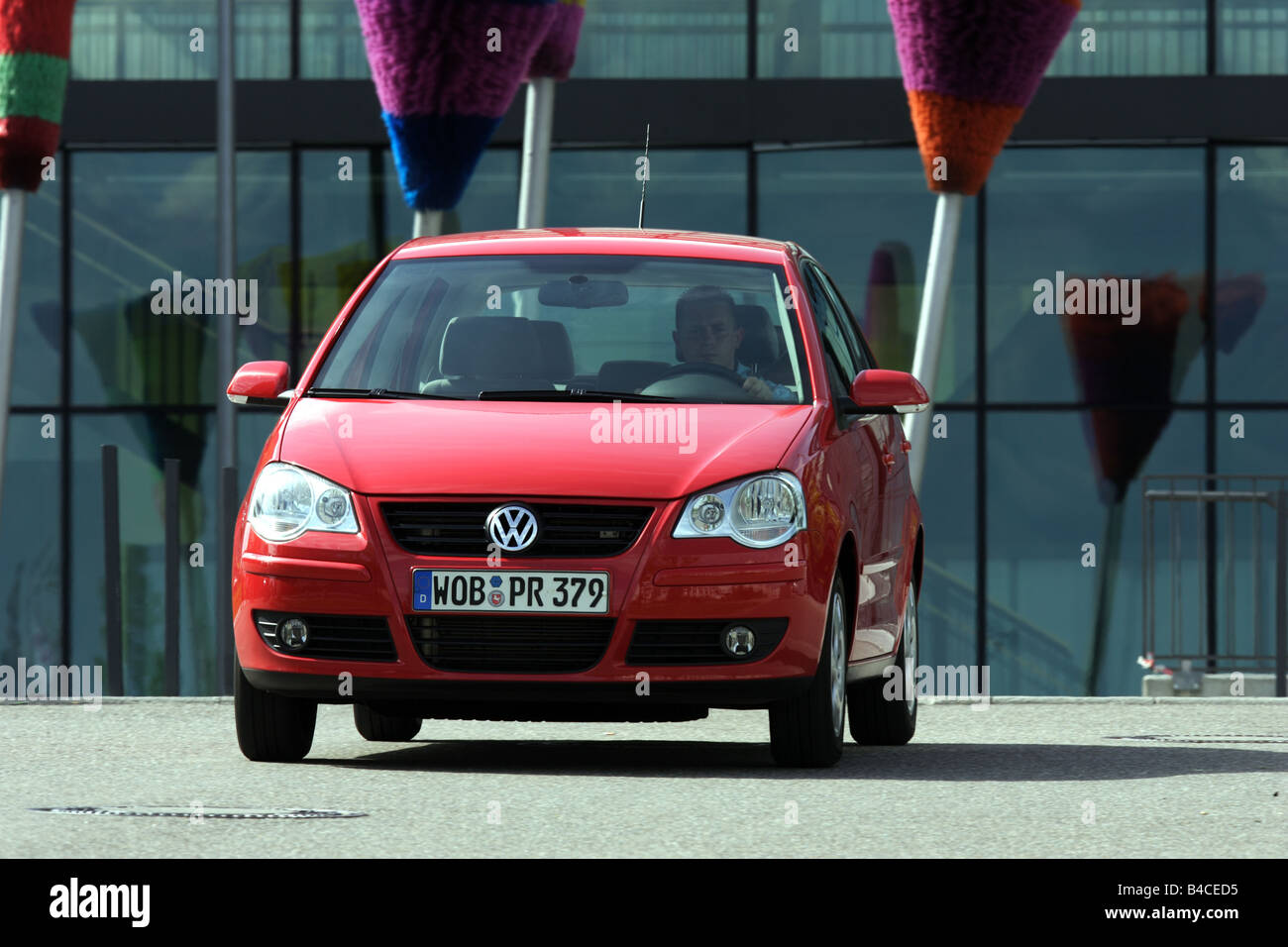 Car VW Volkswagen Polo 1.4 TDI model year 2005 red driving diagonal from the front frontal view City photographer Achi Stock Photo Alamy