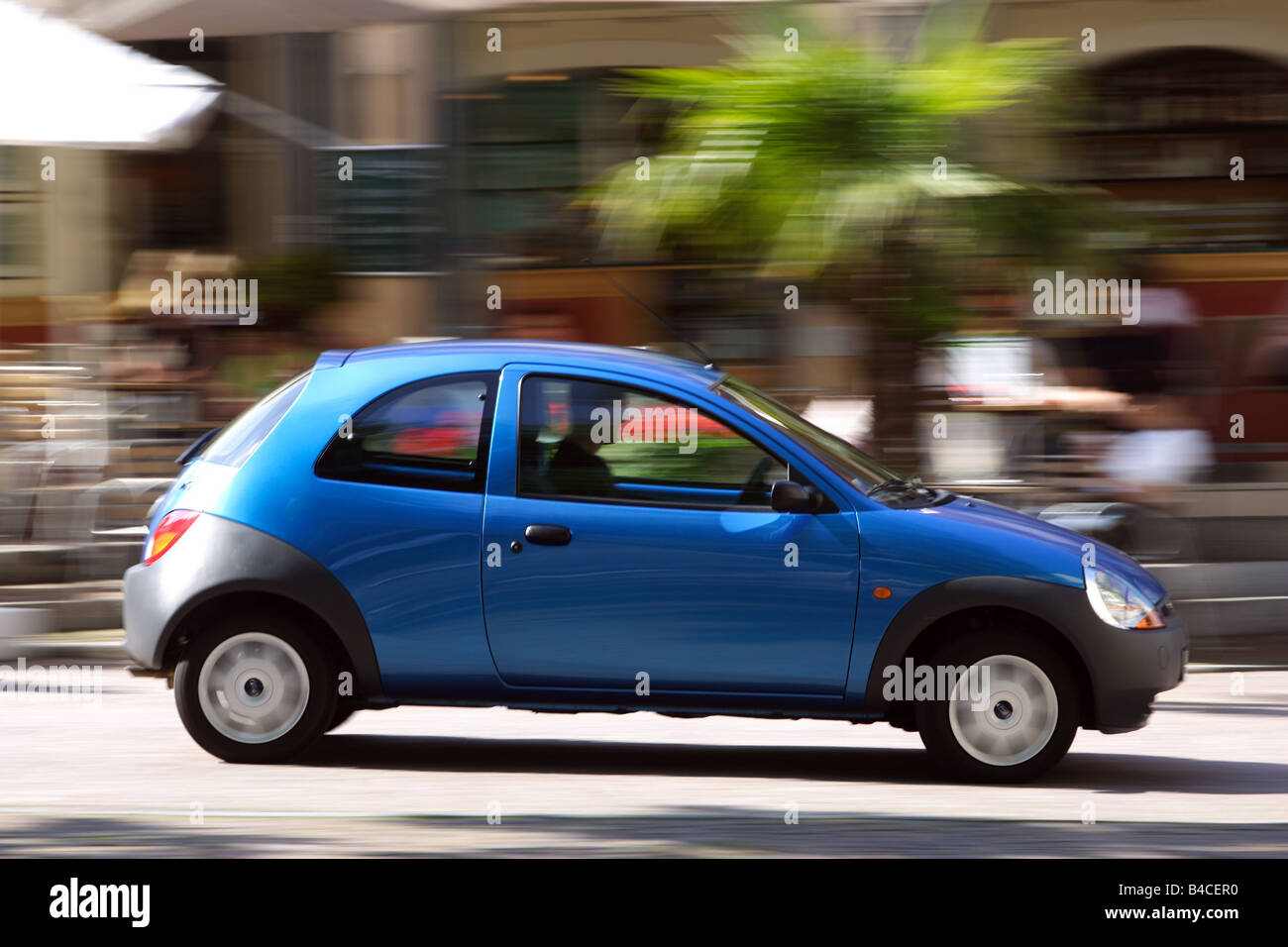 Car, Ford Ka Student, blue, model year 2004-, driving, side view, City, photographer: Achim Hartmann Stock Photo