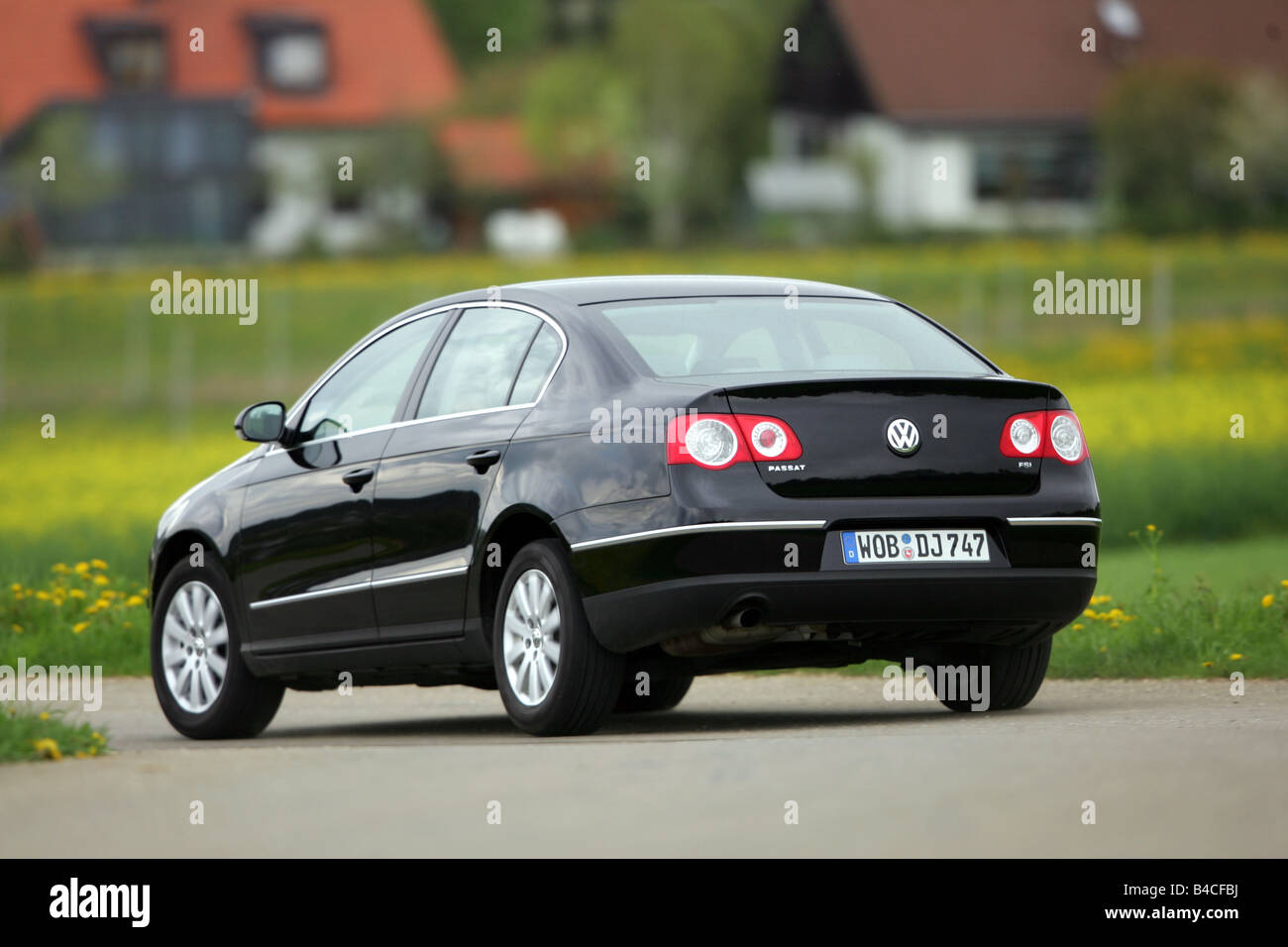 Car, VW Volkswagen Passat 1.6 FSI, Limousine, medium class, model year  2004-, black, driving, diagonal from the back, rear view Stock Photo - Alamy