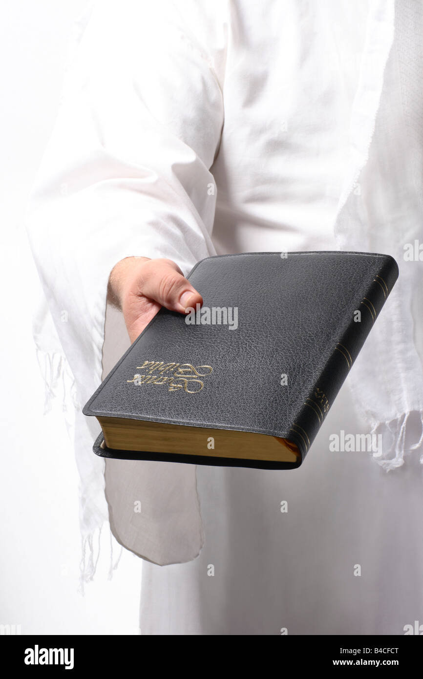 Jesus holding the Bible Stock Photo