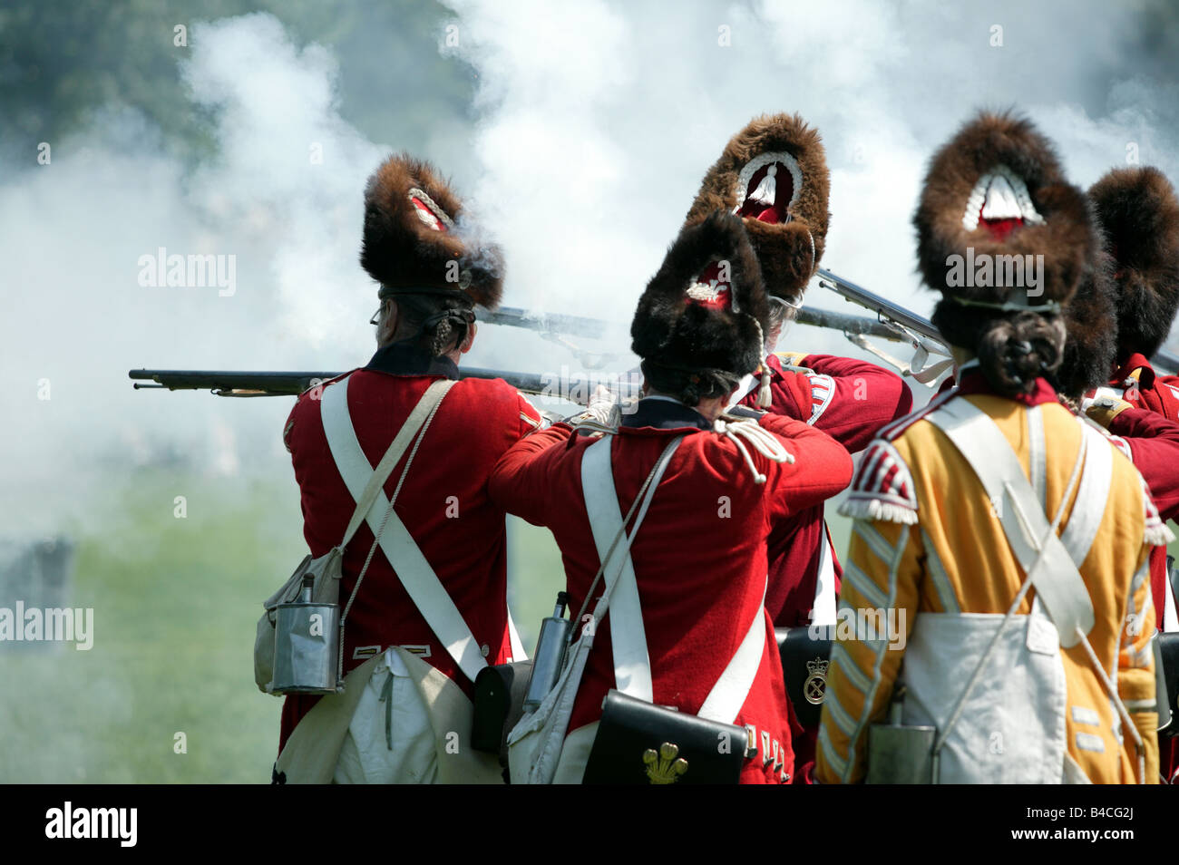 Fog of War: An historic re-enactment of British Foot Guards  battling against rebel colonist Stock Photo