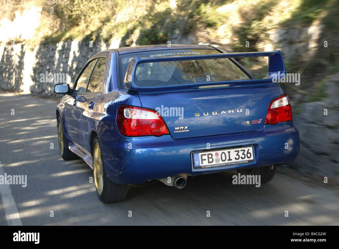 Car, Subaru Impreza WRX STi, Limousine, coupe, Lower middle-sized class,  model year 2003-, blue moving, diagonal from the back Stock Photo - Alamy