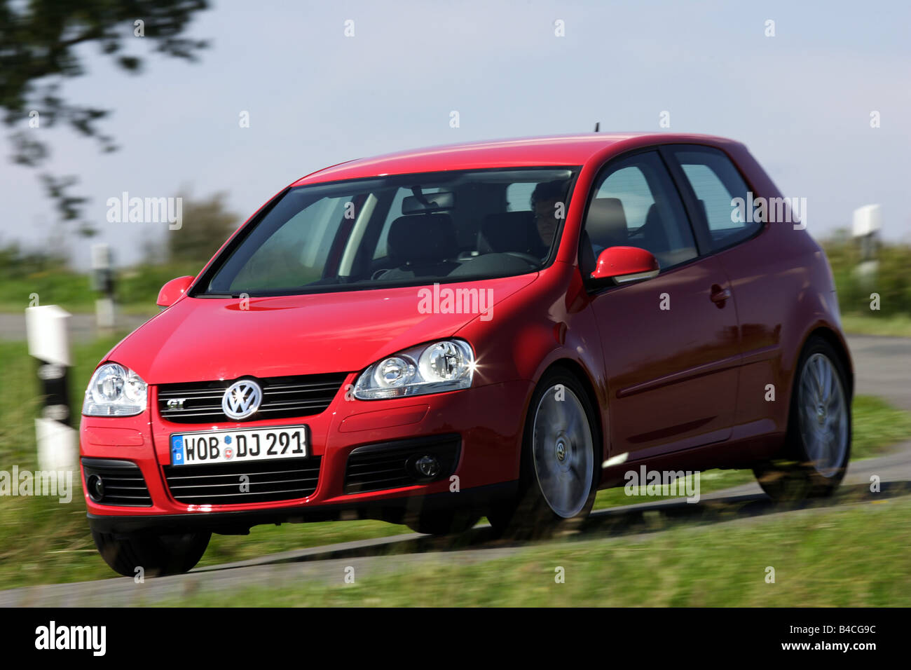 Car, VW Volkswagen Golf GT, model year 2005-, Limousine, Lower middle-sized  class, red, driving, diagonal from the front, fronta Stock Photo - Alamy