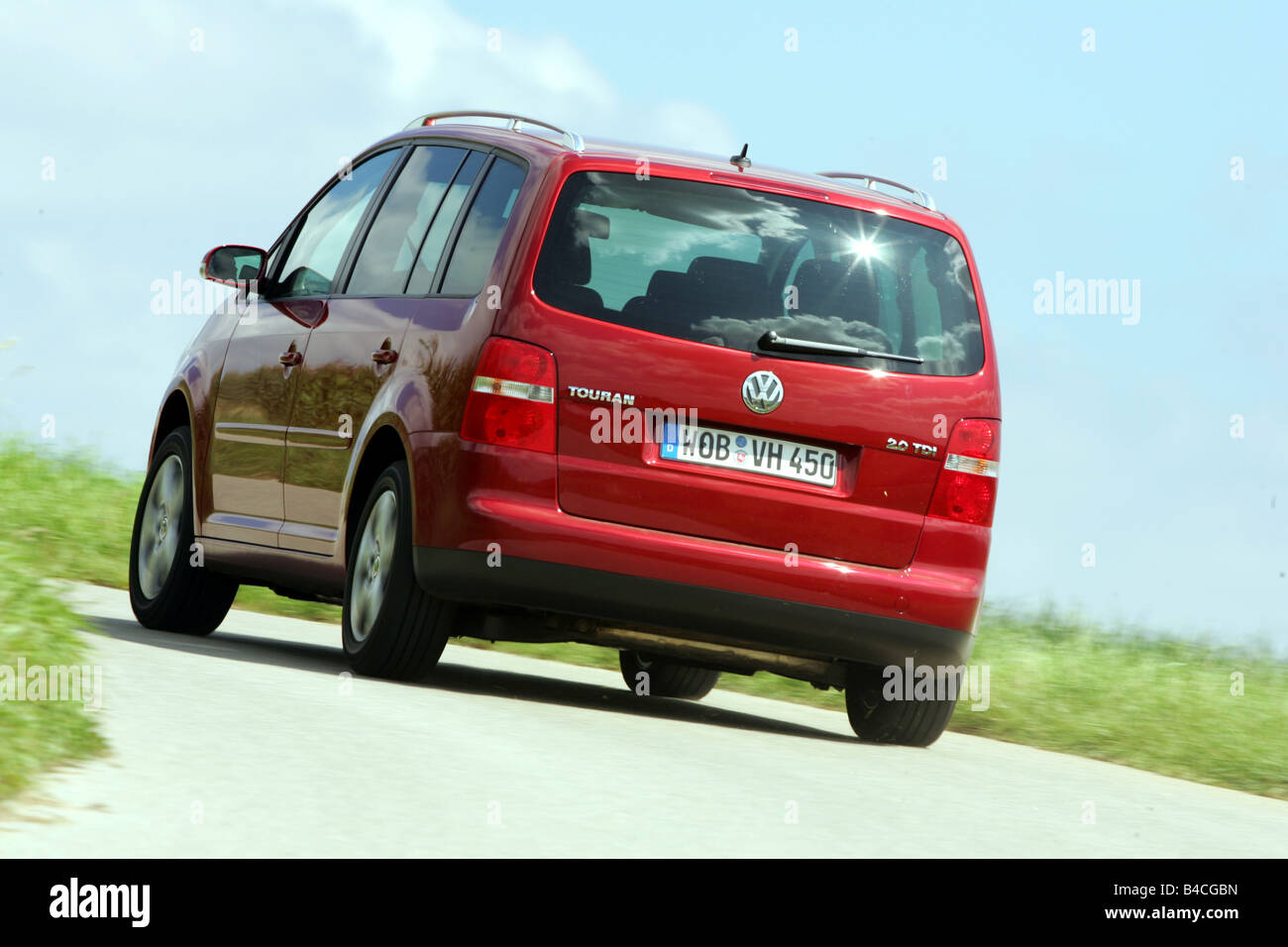 Car, VW Volkswagen Touran 2.0 TDI, Van, model year 2005-, red, driving,  diagonal from the back, rear view, country road Stock Photo - Alamy