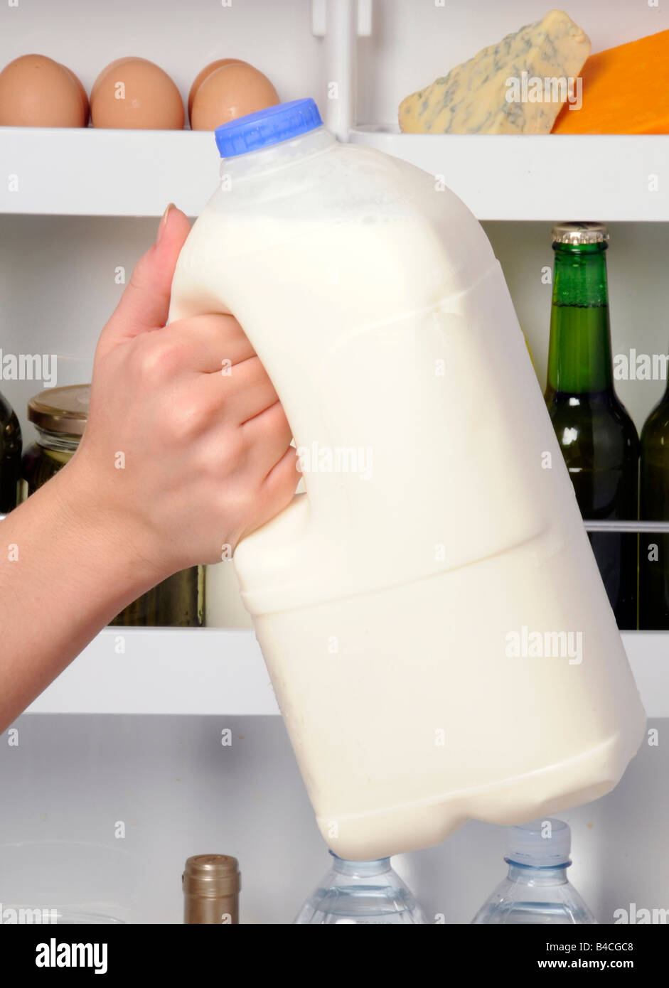 PUTTING PLASTIC MILK BOTTLE IN FRIDGE Stock Photo Alamy