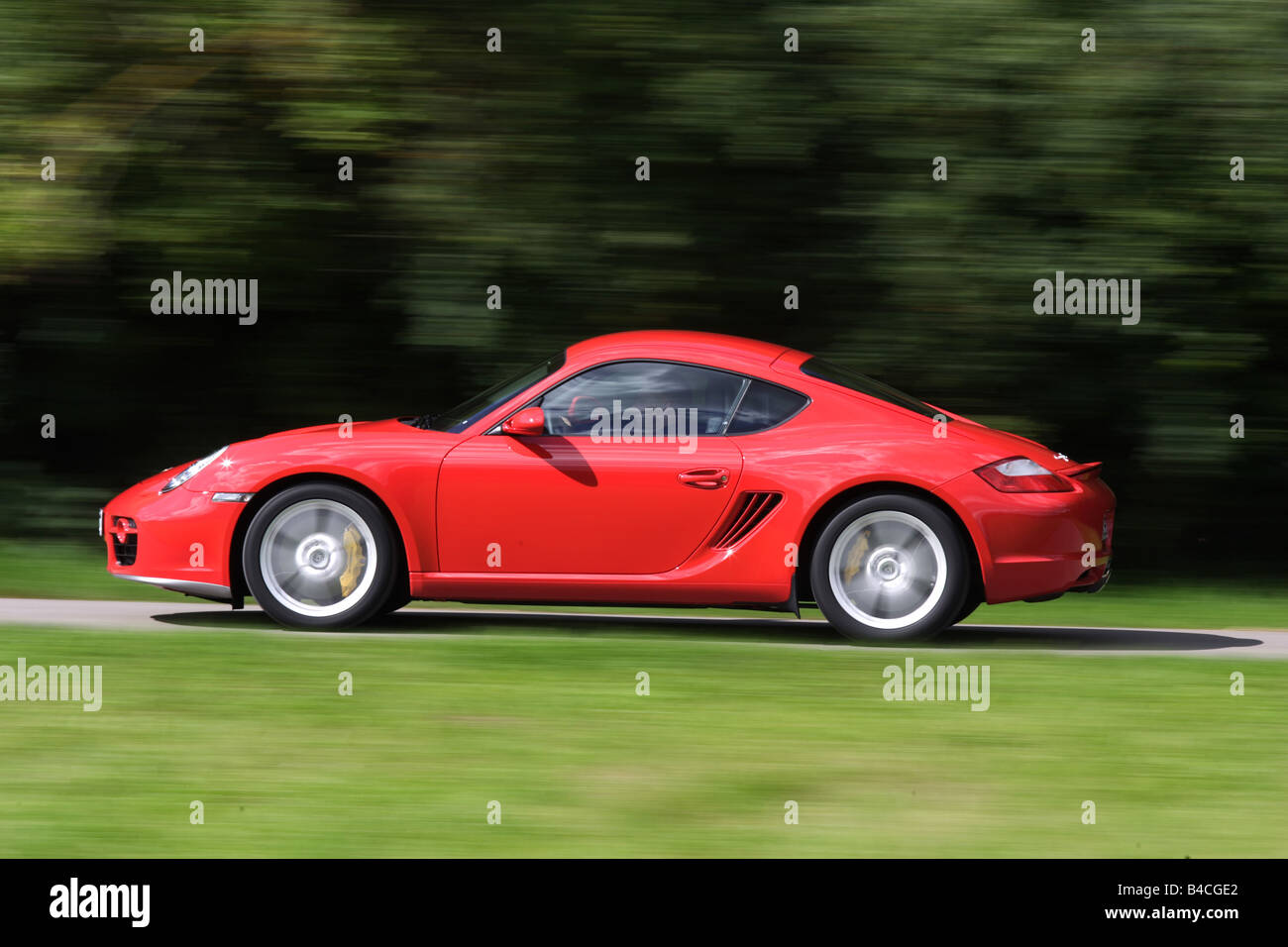 Car, Porsche Cayman S, roadster, model year 2005-, red, driving, side view, country road Stock Photo
