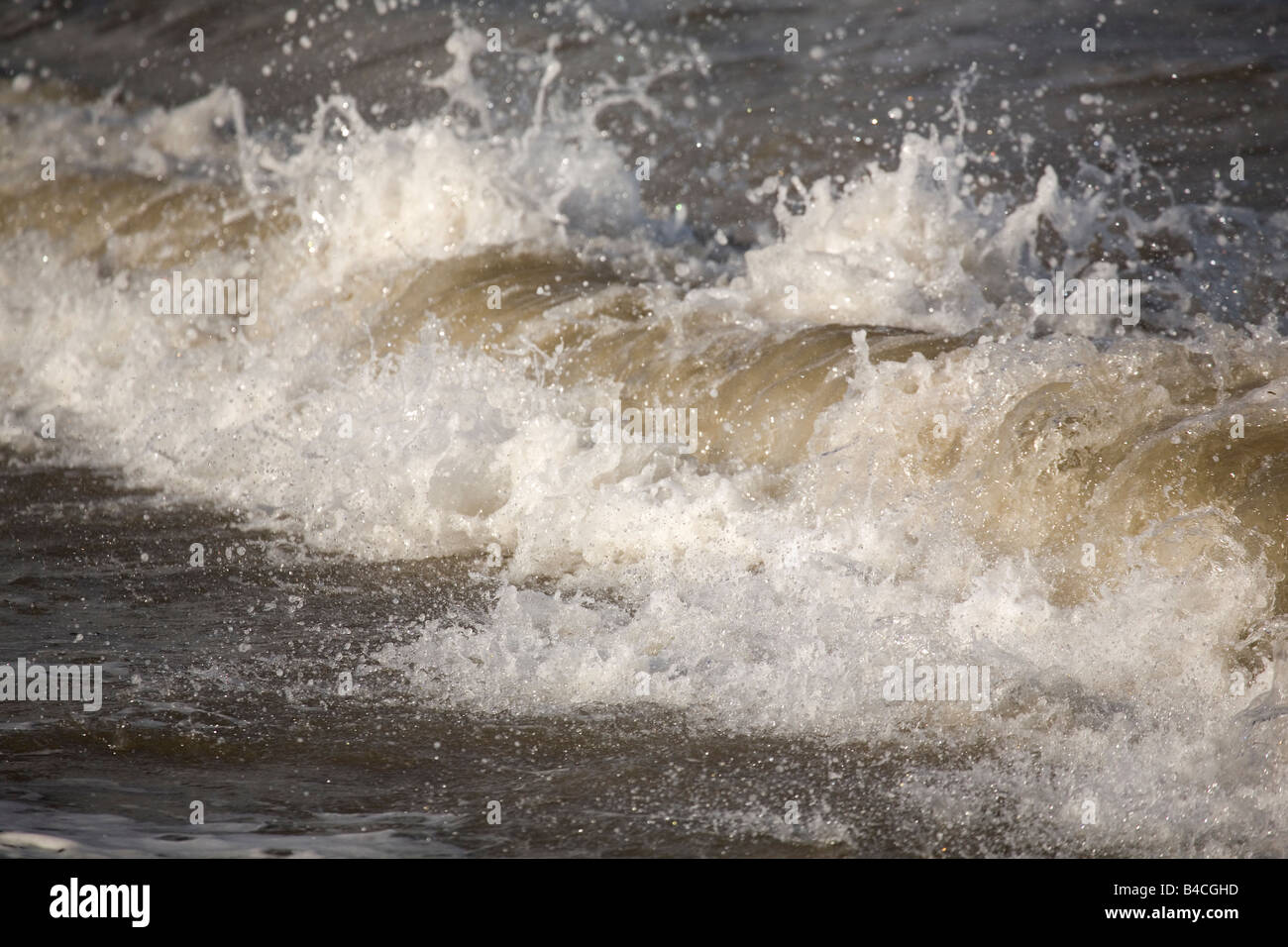 Waves crash and spray onto the northeast coast of England. Stock Photo