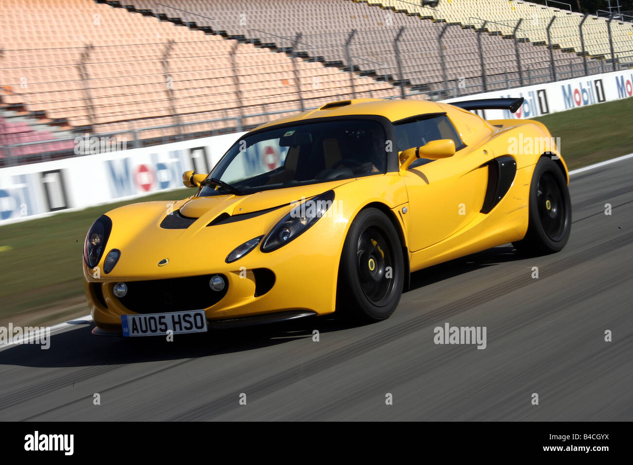 Lotus Exige 240R, model year 2005-, yellow, driving, diagonal from ... Lotus Exige 240R, model year 2005-, yellow, driving, diagonal from ...