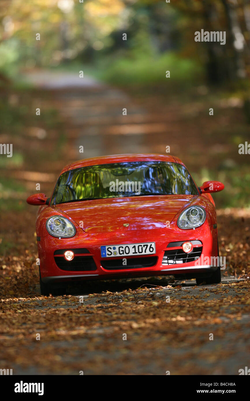 Porsche Cayman S, roadster, model year 2005-, red, driving, diagonal from the front, frontal view, country road, landsapprox.e, Stock Photo