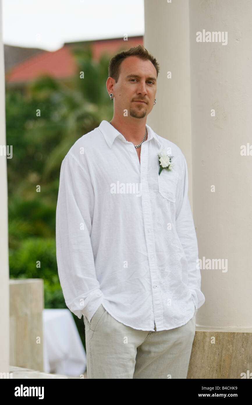 groom smiling for a photo at his wedding Stock Photo - Alamy