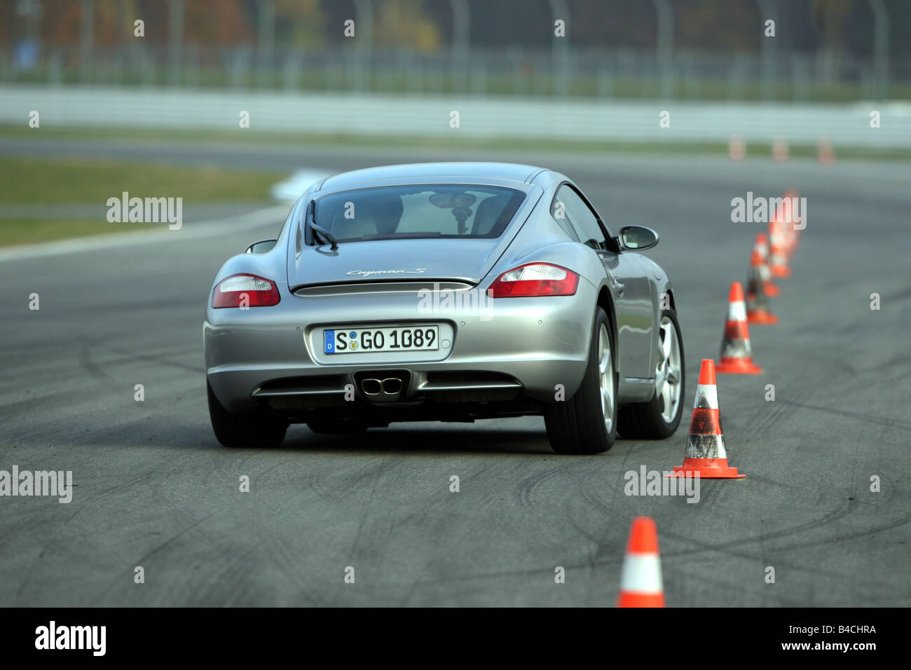 Porsche Cayman S, roadster, model year 2005-, silver, driving, diagonal  from the back, rear view, test track, Pilonen Stock Photo - Alamy