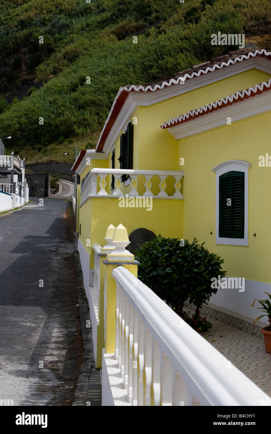 Azores ,yellow house in narrow street in the small willage Mosteiros