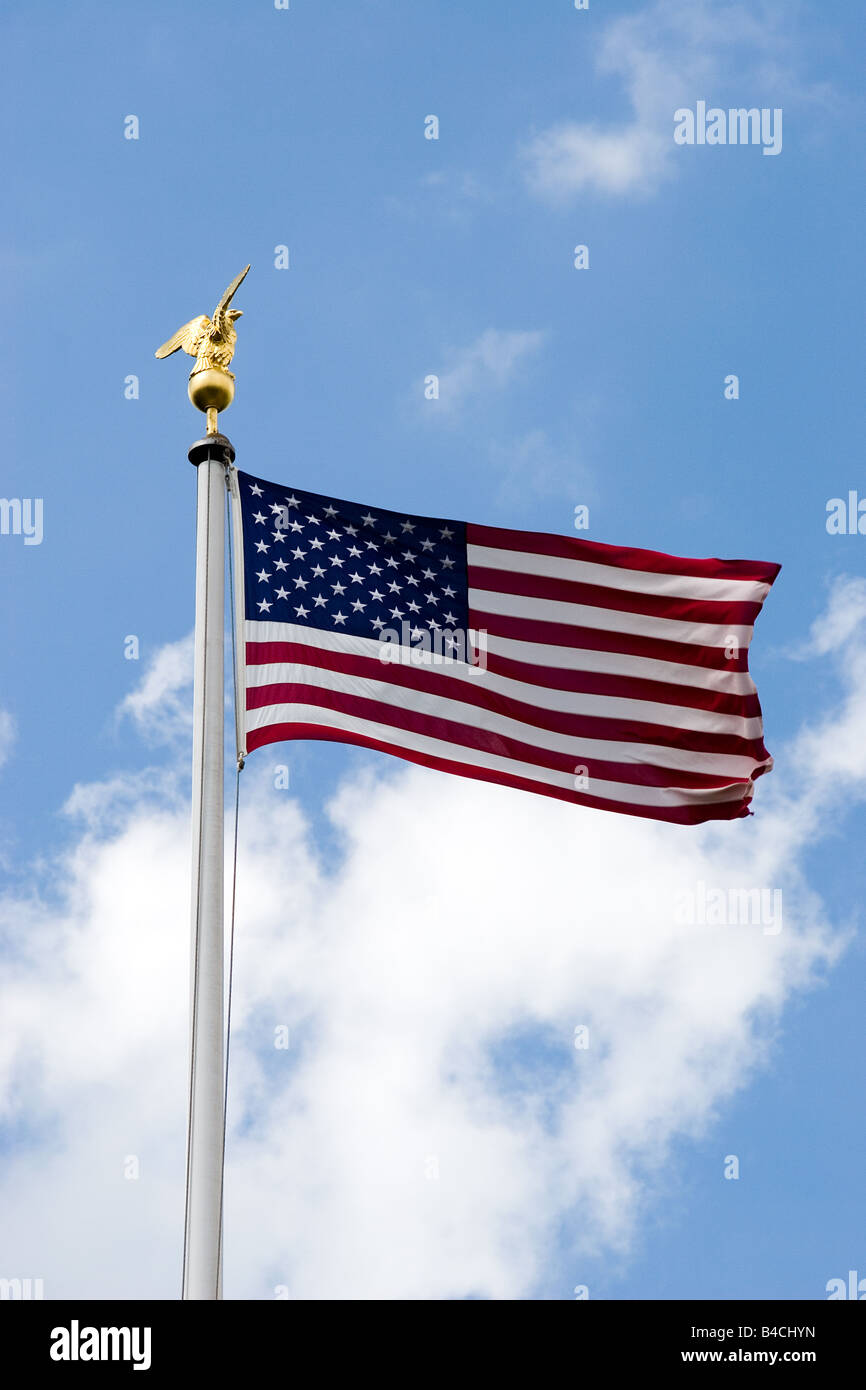 the american flag blowing outside American cemetery in Cambridge England Stock Photo