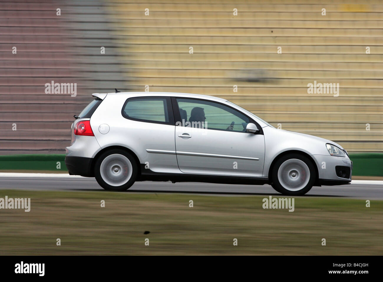 VW Volkswagen Golf GTI, model year 2004-, silver-moving, driving, side  view, Test track Stock Photo - Alamy