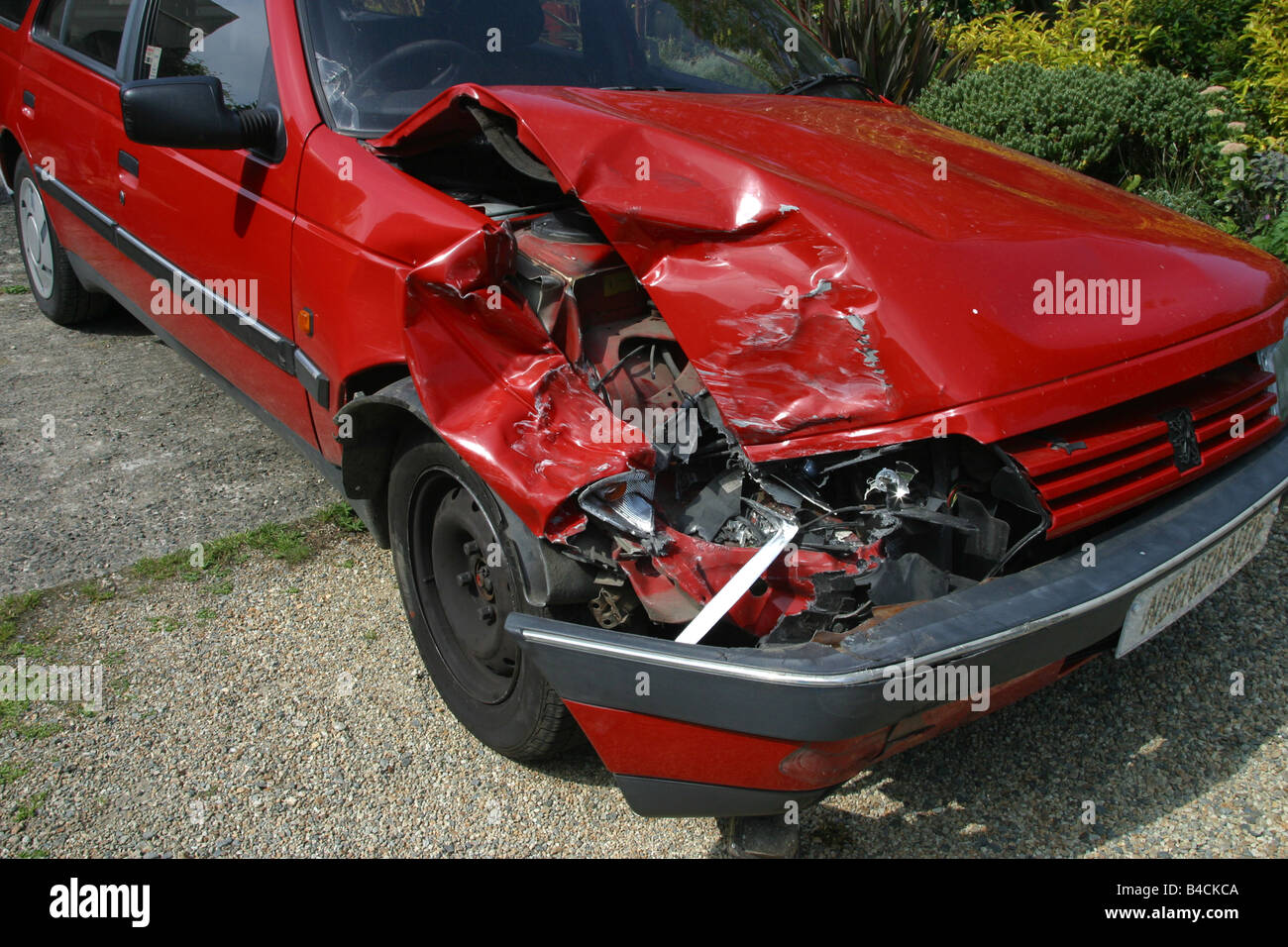 Front end Red car crashed crumple . horizontal format. 50010 crash