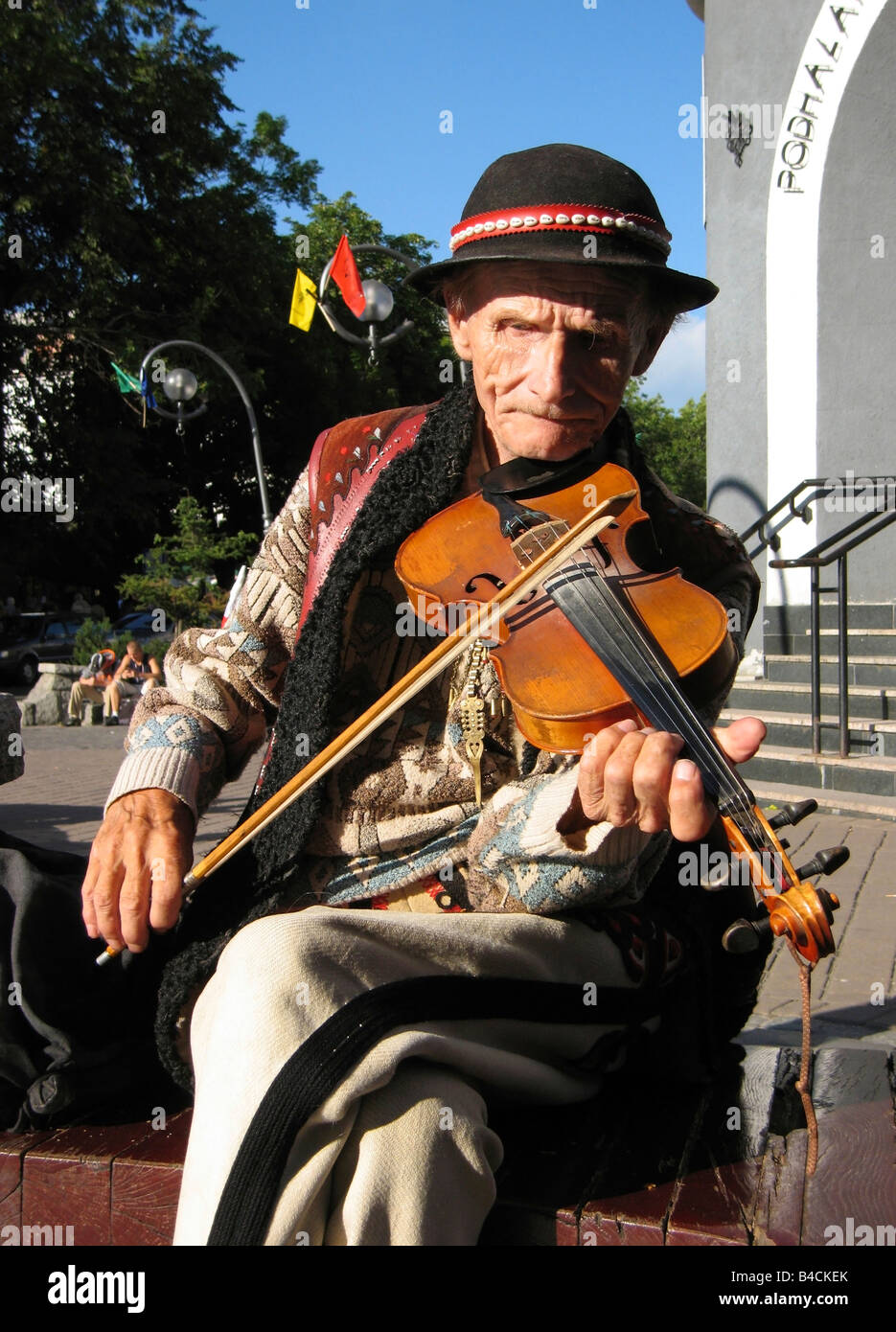 Poland Zakopane town Tatras Mt Krupowki Street Man playing Stock Photo