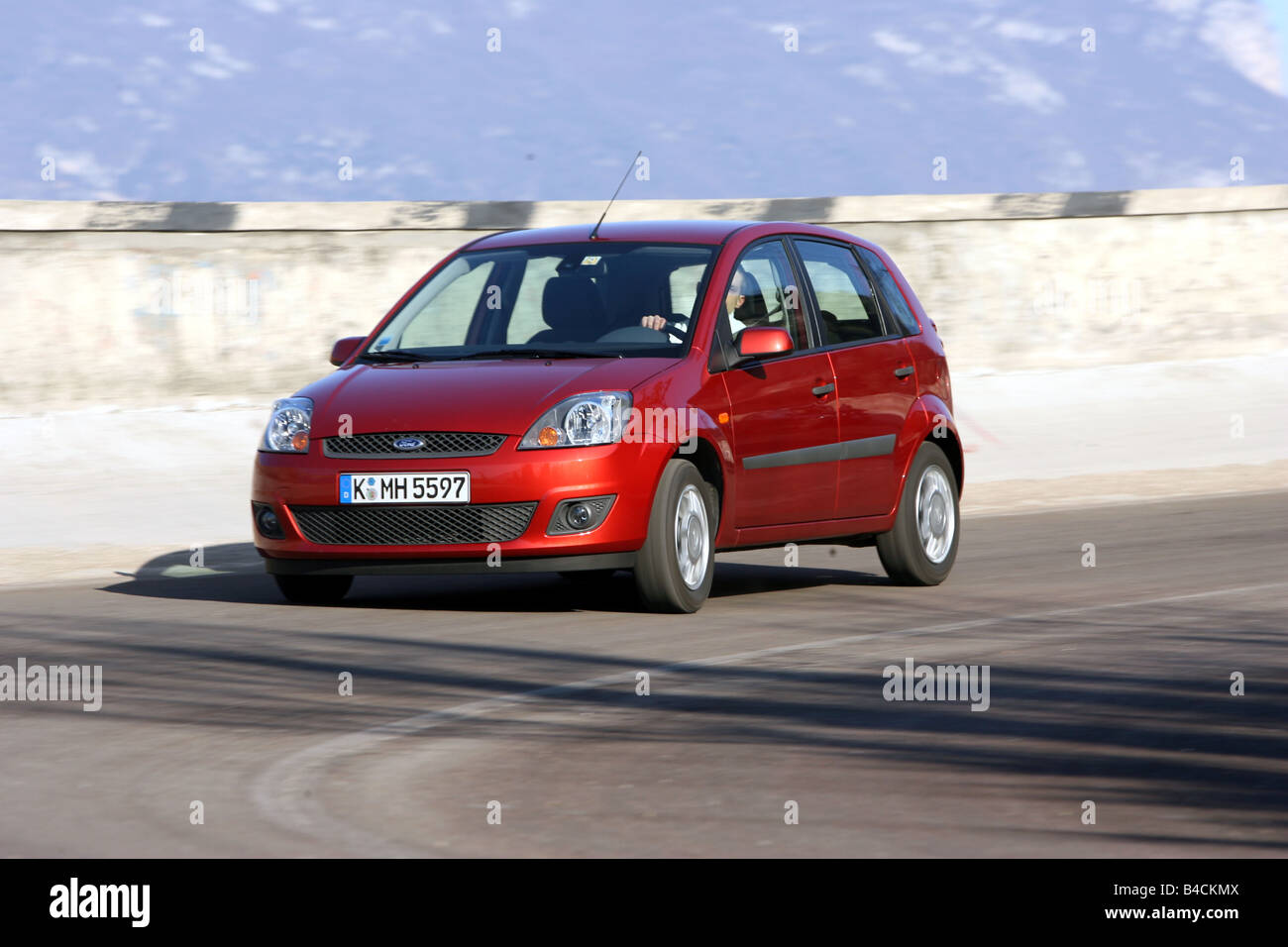 Ford Fiesta 1 4 16v Model Year 05 Rust Red Driving Diagonal Stock Photo Alamy