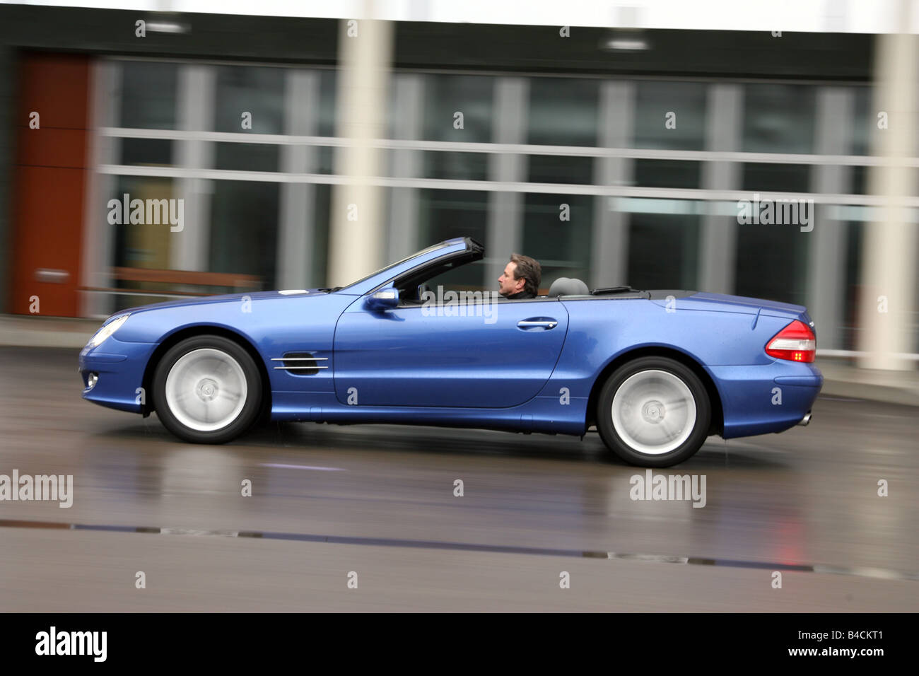 Mercedes SL 500, model year 2005-, blue moving, side view, City, open top Stock Photo