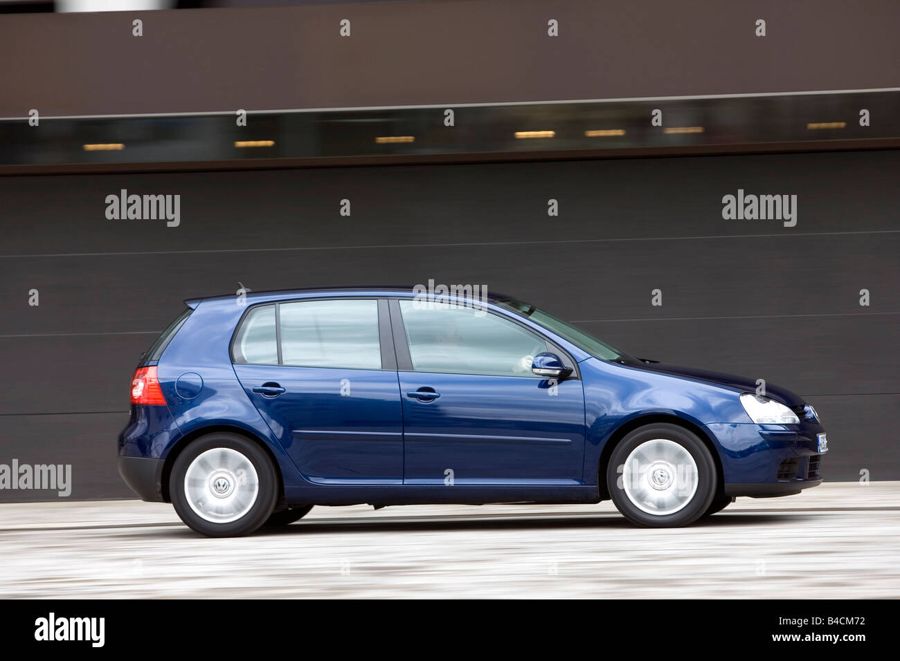 VW Volkswagen Golf GT 2.0 TDI, dark blue, model year 2005-, driving, side  view, City Stock Photo - Alamy