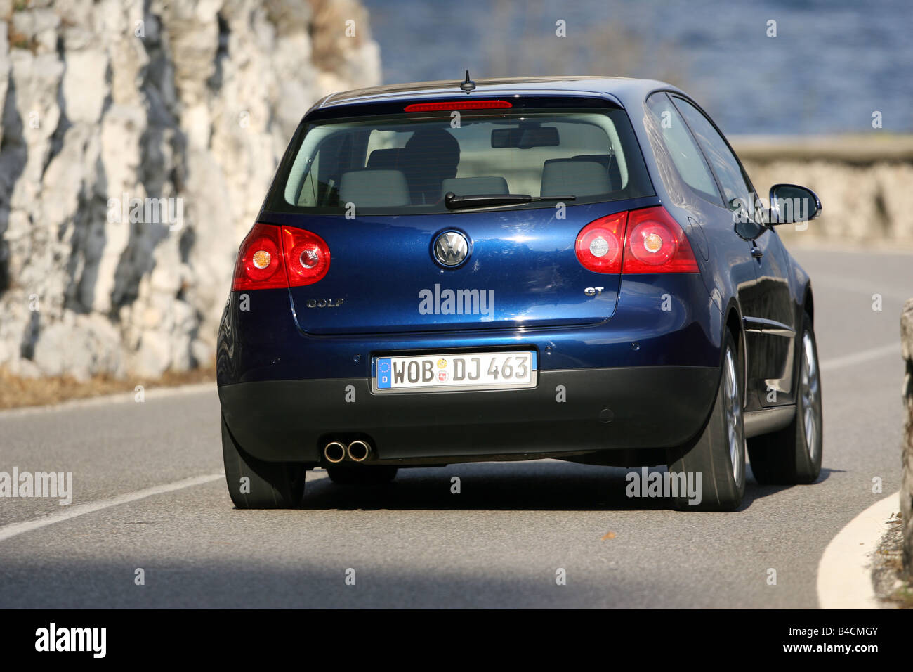 VW Volkswagen Golf GT 2.0 TDI, dark blue, model year 2005-, driving,  diagonal from the back, rear view, country road Stock Photo - Alamy