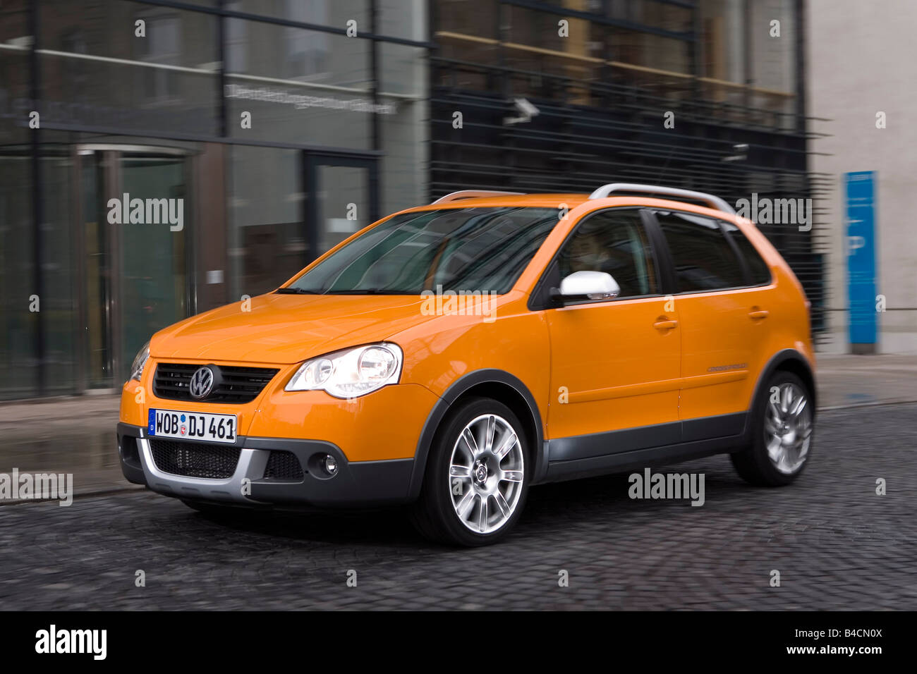 VW Volkswagen Cross Polo 1.4 TDI, model year 2006-, orange , driving,  diagonal from the front, frontal view, City Stock Photo - Alamy