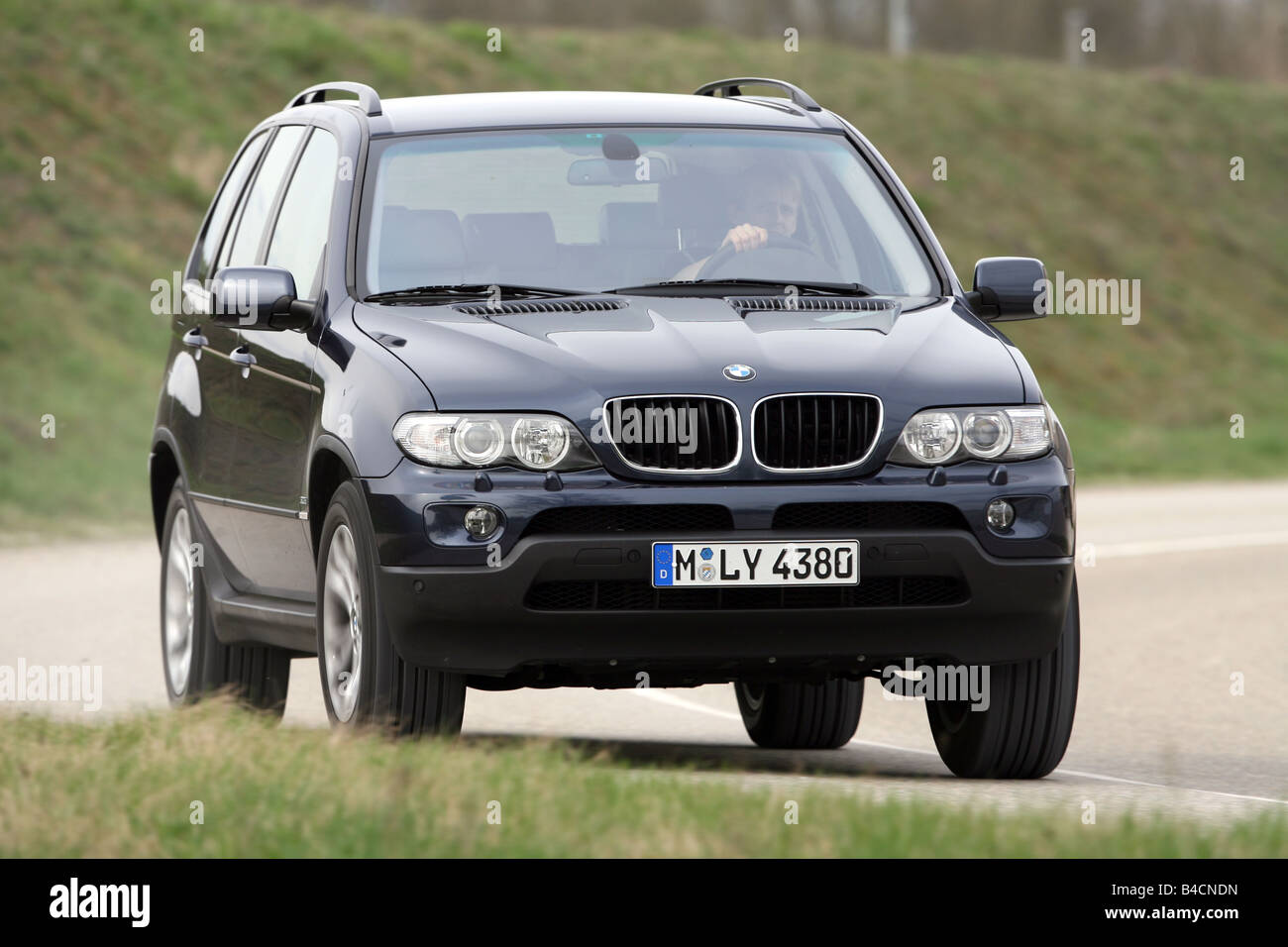 BMW X5 3 0d model year 2003 black driving diagonal from