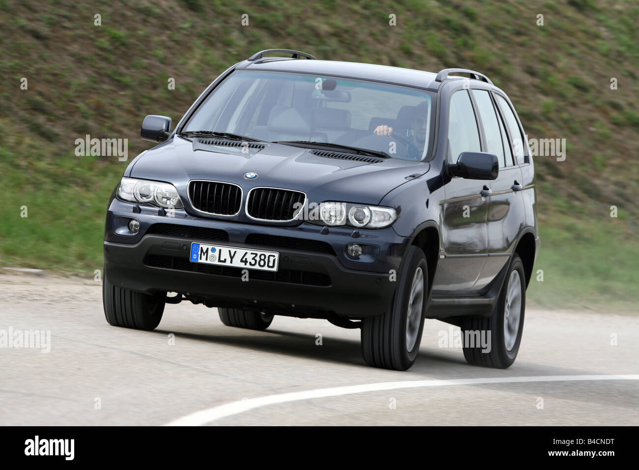 BMW X5 3 0d model year 2003 black driving diagonal from
