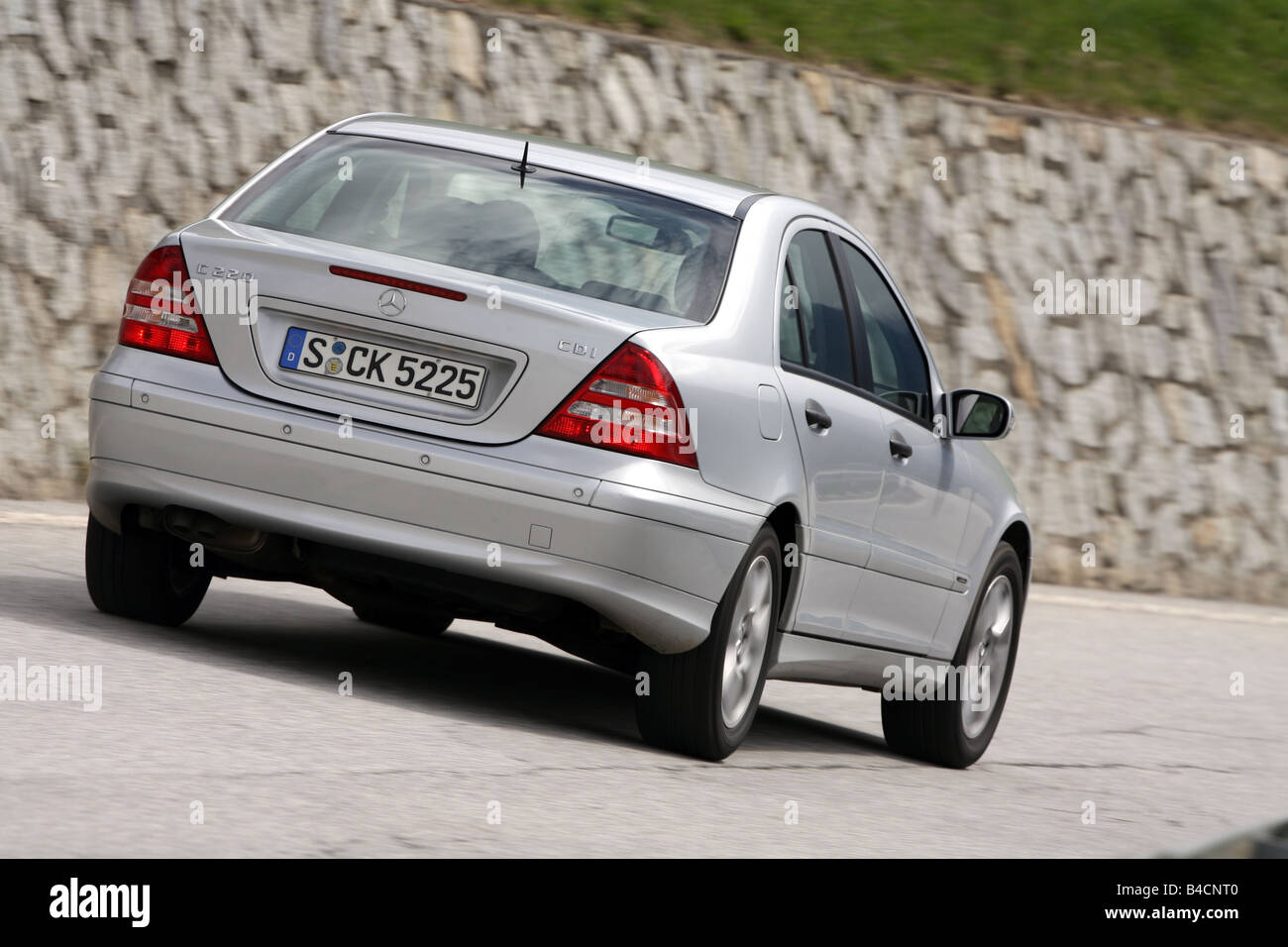Mercedes C 220 CDI, model year 2005-, silver, driving, diagonal from the  back, rear view, country road Stock Photo - Alamy