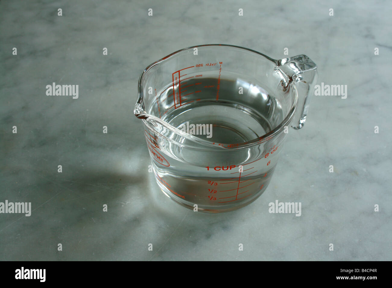Pyrex glass jug containing water. Stock Photo