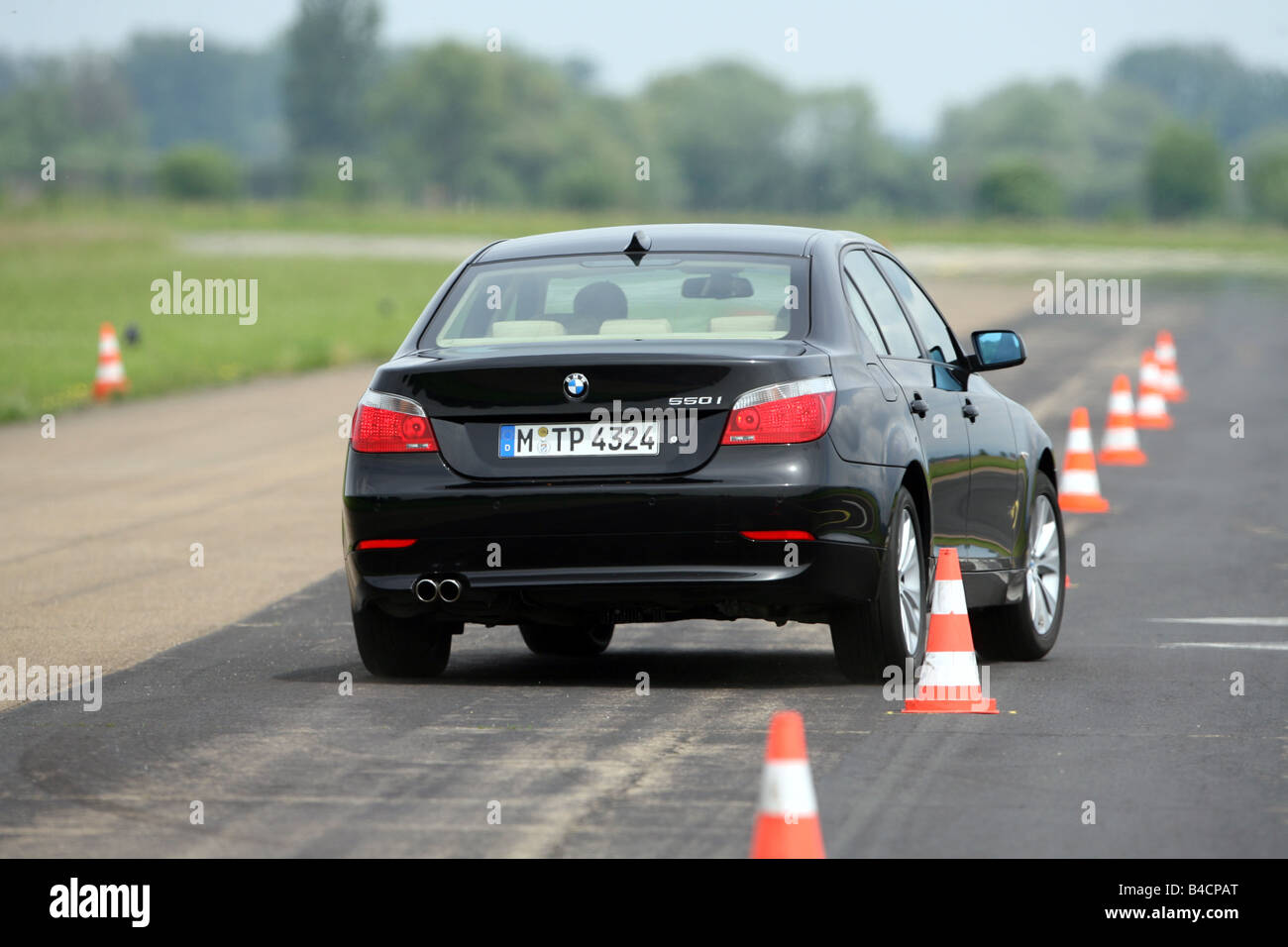 BMW M5, model year 2005-, black, driving, diagonal from the front, frontal  view, test track Stock Photo - Alamy