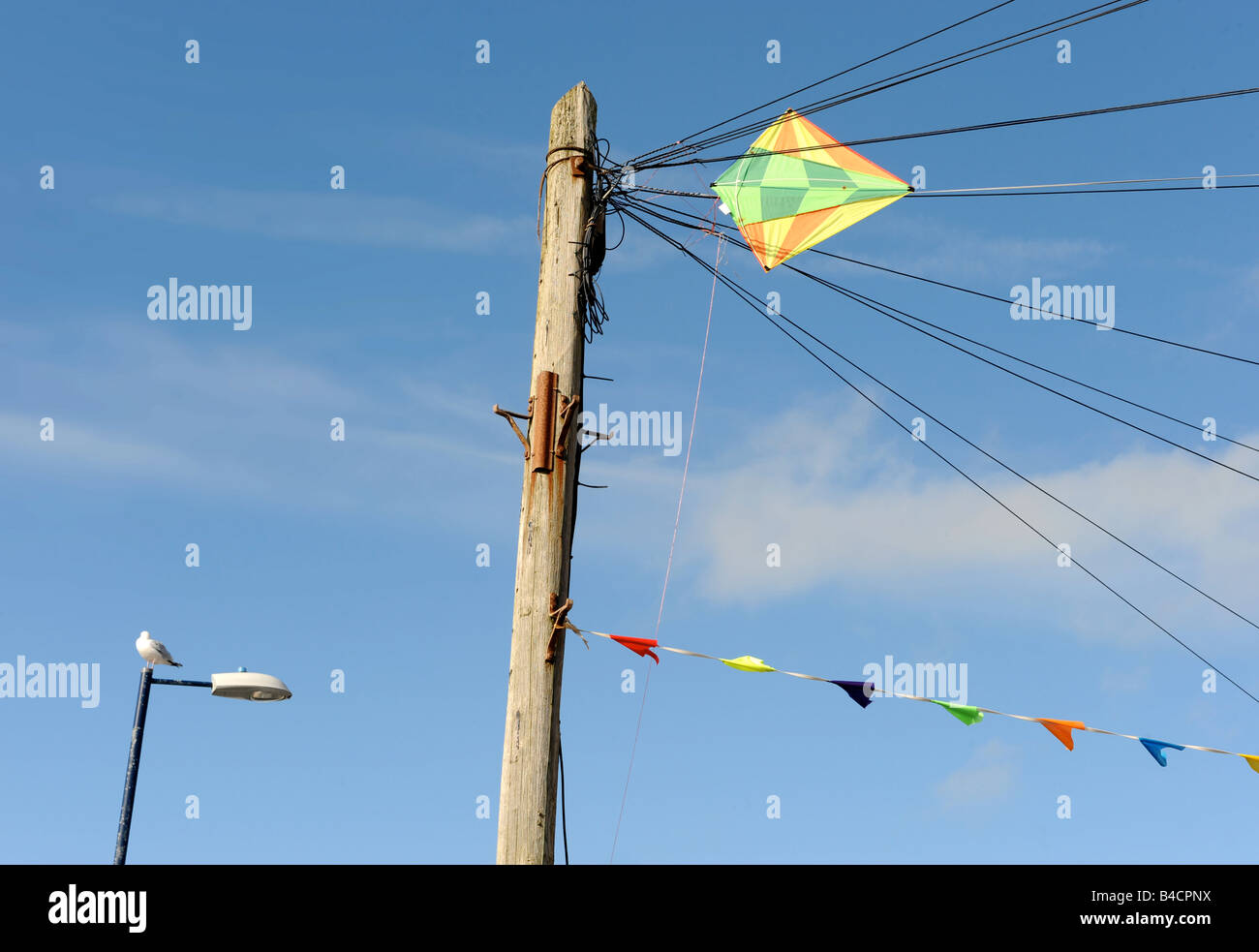 A KITE CAUGHT IN TELEGRAPH WIRES ON THE BEACH FRONT AT BORTH IN