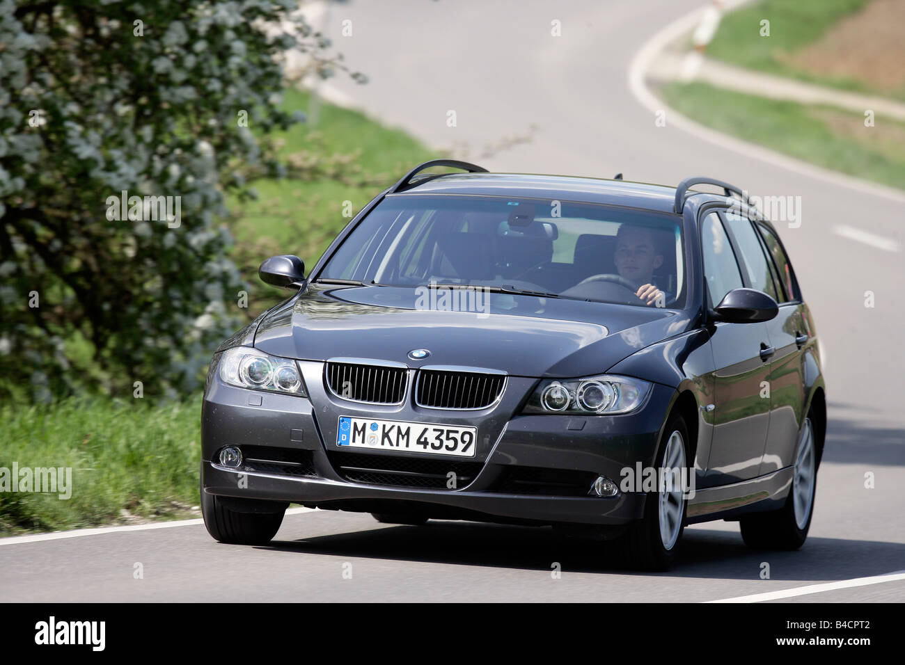 BMW 320i Touring, model year 2006-, black, driving, diagonal from the  front, frontal view, country road Stock Photo - Alamy