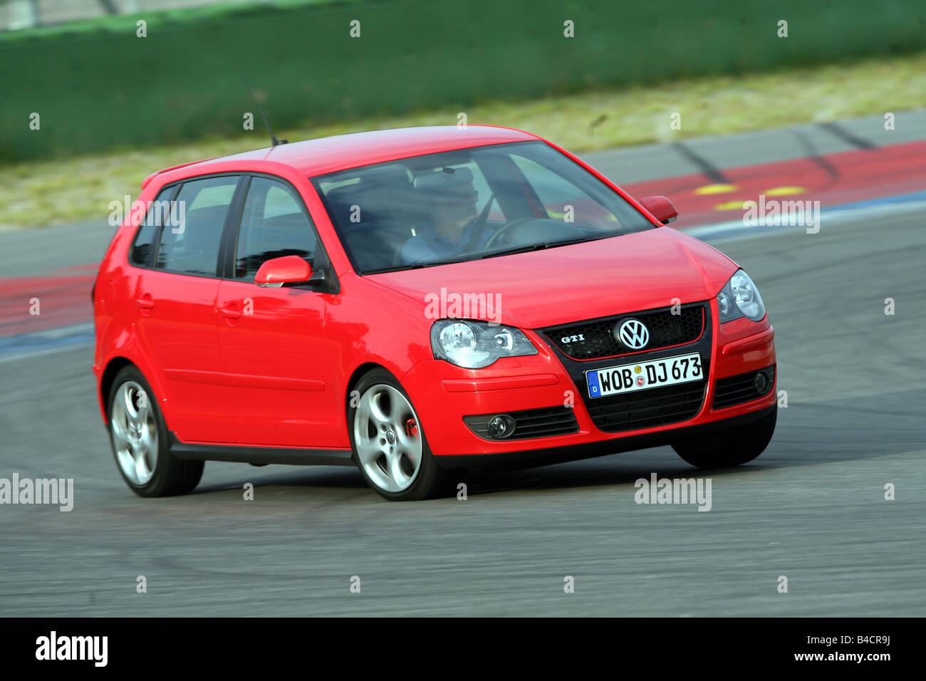 VW Volkswagen Polo GTI, model year 2005-, red, driving, diagonal from the  front, frontal view, test track Stock Photo - Alamy
