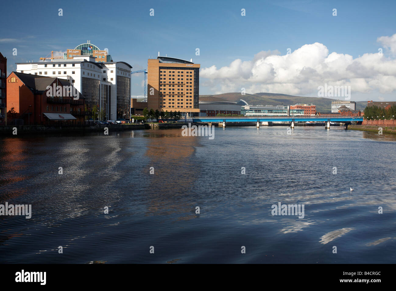 modern office buildings and hilton hotel along the river lagan belfast city centre northern ireland uk Stock Photo