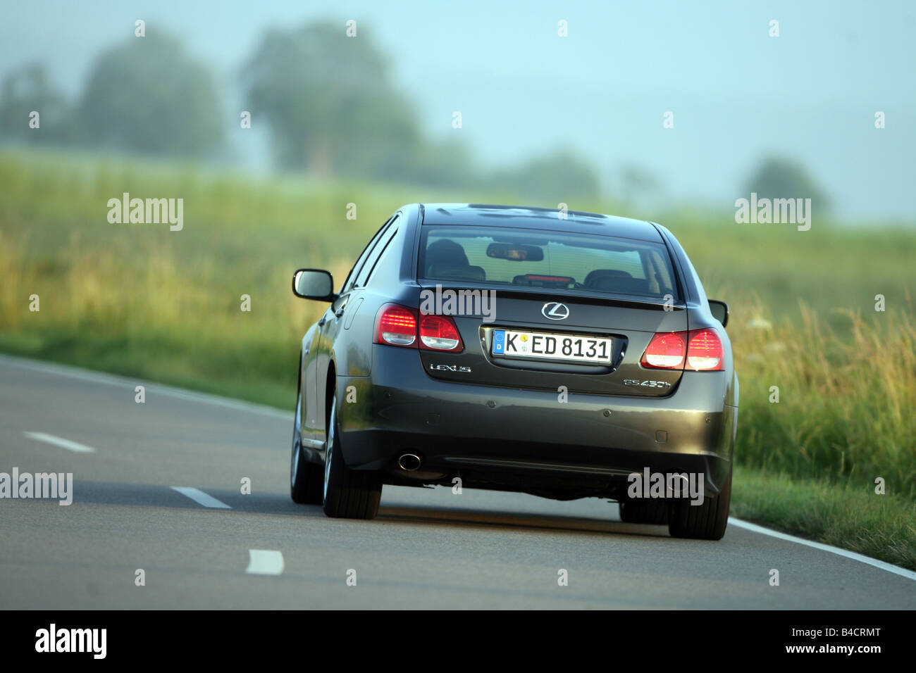 Lexus GS 450, model year 2006-, black, driving, diagonal from the back, rear view, country road Stock Photo