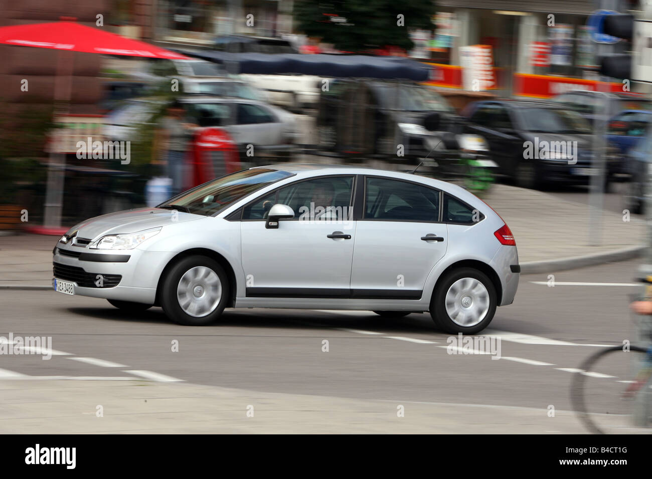 Citroen C4 1.4i 16V, model year 2004-, silver, driving, side view, City  Stock Photo - Alamy
