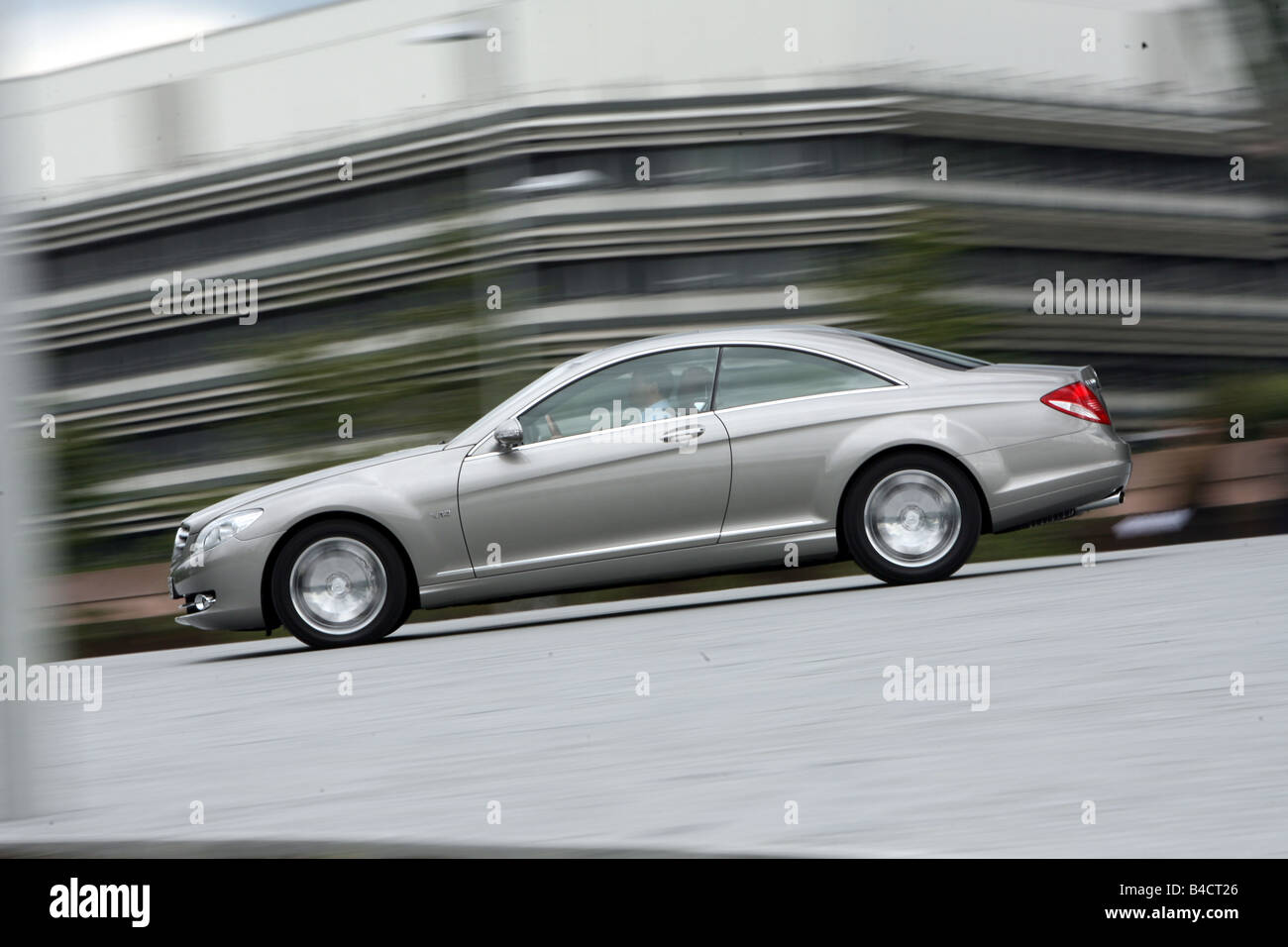 Mercedes CL 600, model year 2006-, silver, driving, side view, City Stock Photo