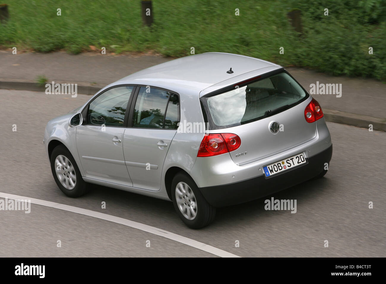 VW Volkswagen Golf 1.4 16V, model year 2004-, silver, driving, diagonal  from the back, rear view, country road Stock Photo - Alamy