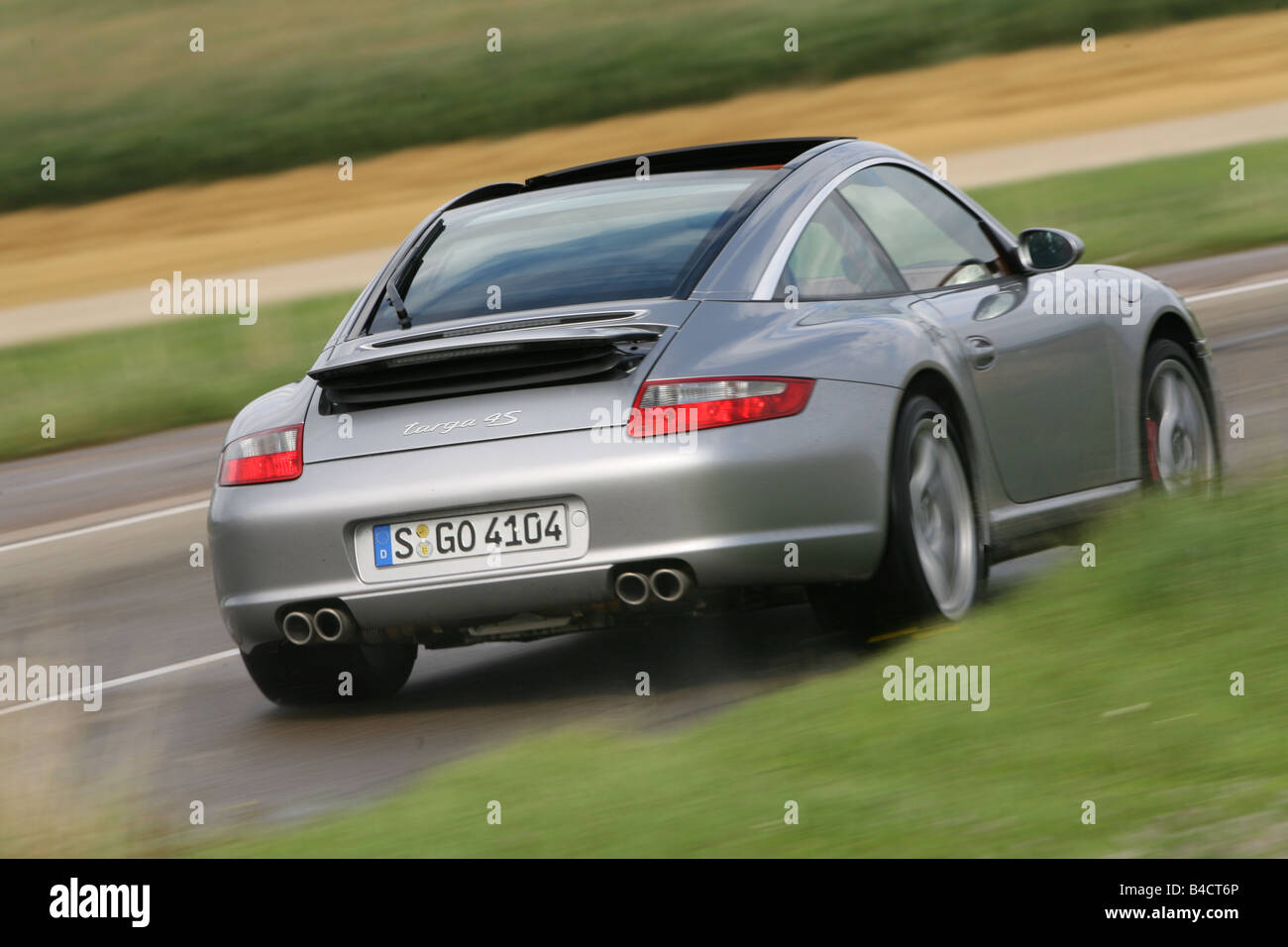 Porsche Carrera 911 Targa 4S, model year 2006-, driving, diagonal from the  back, rear view, country road Stock Photo - Alamy