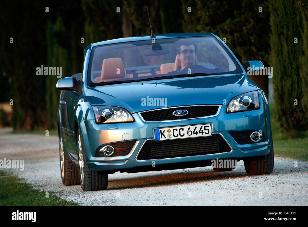 Ford Focus Coupe-Convertible 2.0, model year 2006-, driving, diagonal from the front, frontal view, country road, open top Stock Photo