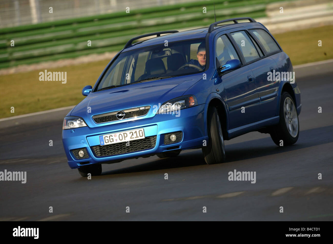 Car, Opel Astra OPC hatchback, Lower middle-sized class, model year 2002-,  blue moving, test track, diagonal from the front, Fro Stock Photo - Alamy