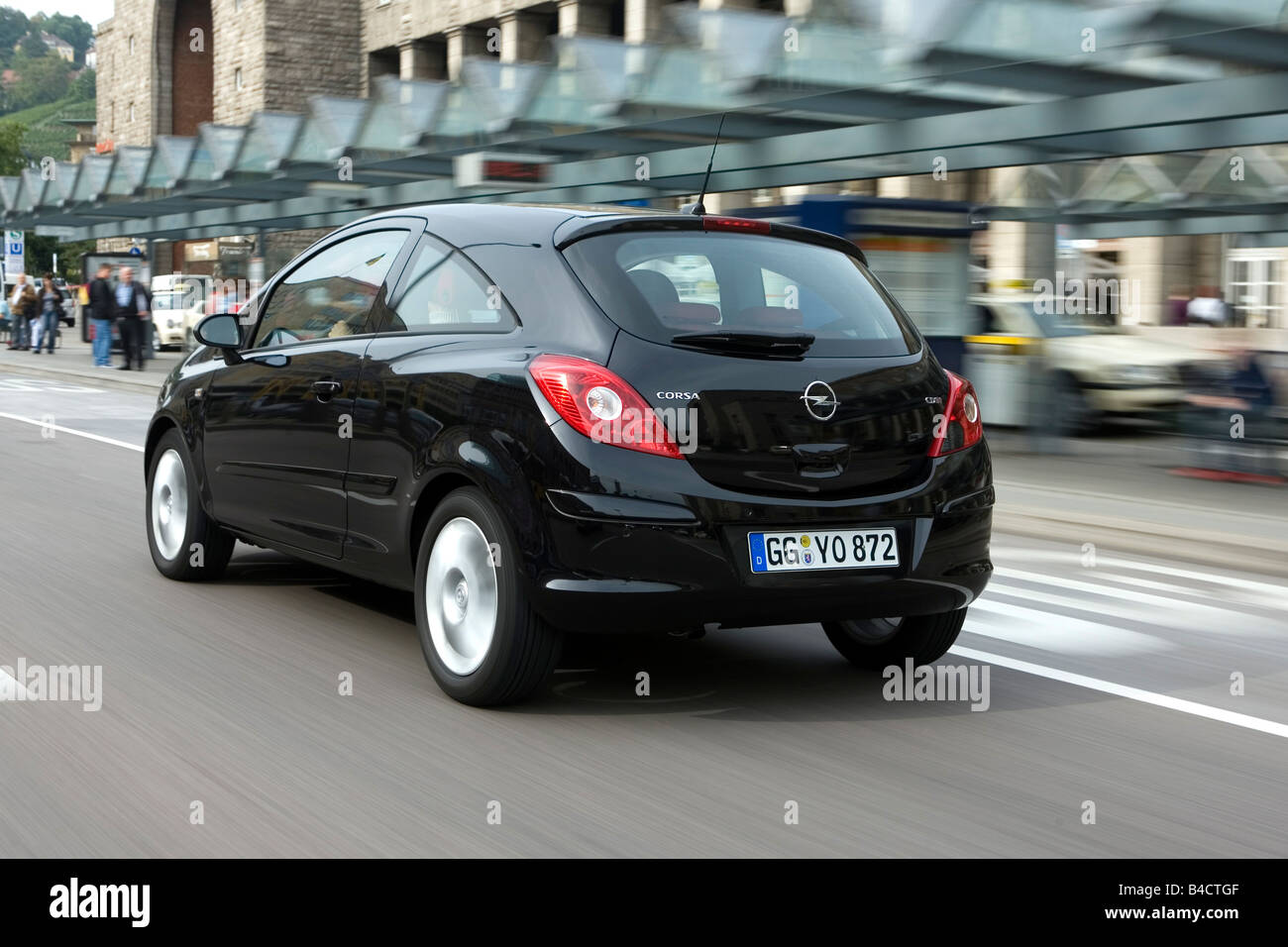 Opel Corsa 1.3 CDTI Edition, model year 2006-, black, driving, diagonal  from the back, rear view, City Stock Photo - Alamy