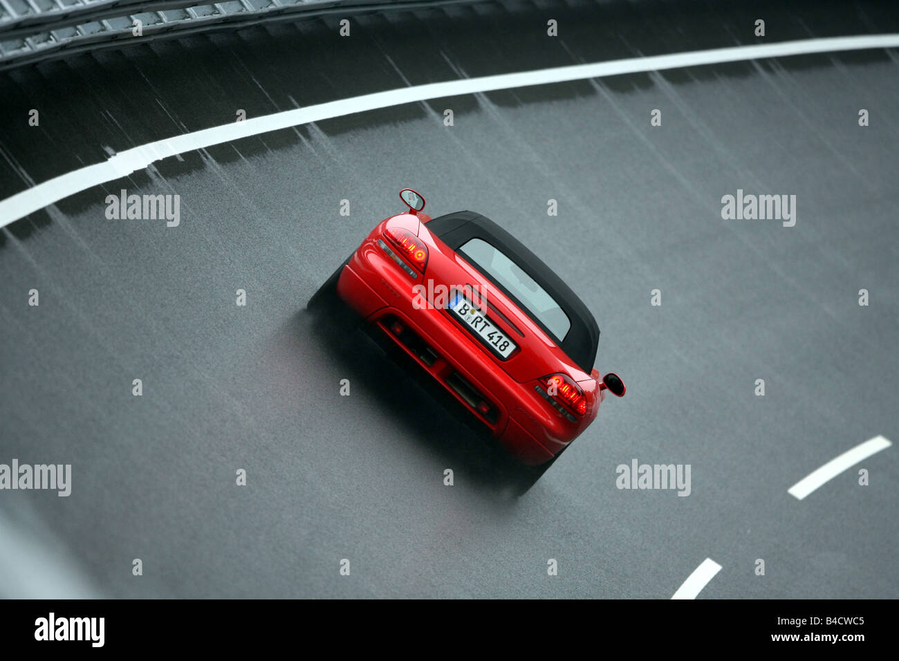 Dodge Viper SRT-10, model year 2004-, red, driving, diagonal from the back, rear view, test track, closed top Stock Photo