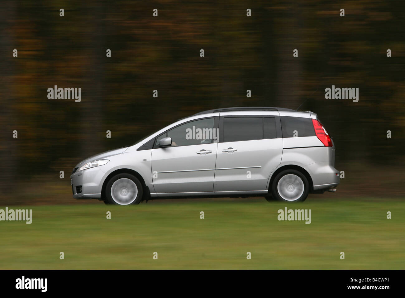 Mazda 5 2.0 MZR Top, silver, model year 2005-, driving, side view, country road Stock Photo