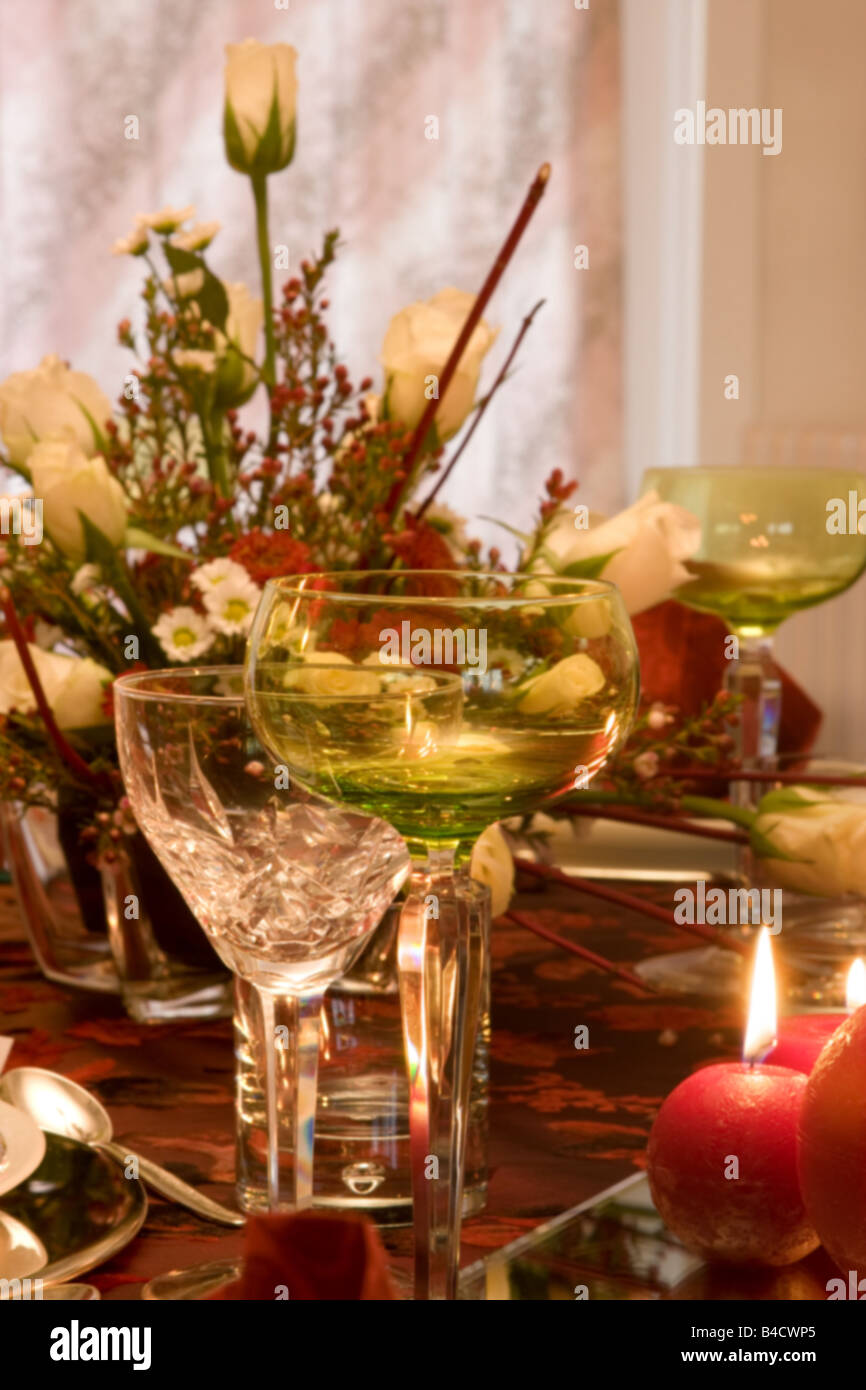 Christmas dinner table with flowers and red candles Stock Photo Alamy