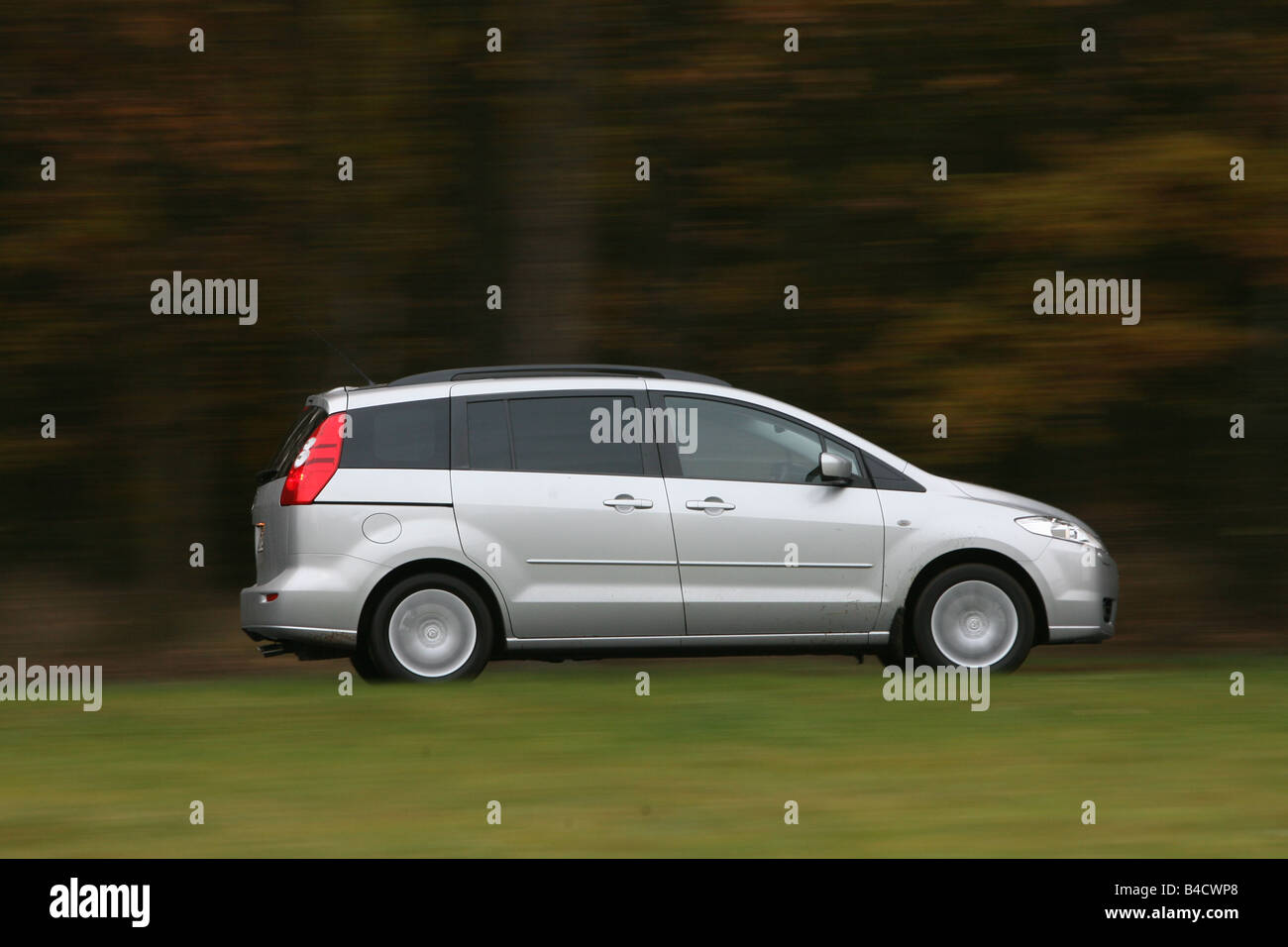 Mazda 5 2.0 MZR Top, silver, model year 2005-, driving, side view, country road Stock Photo