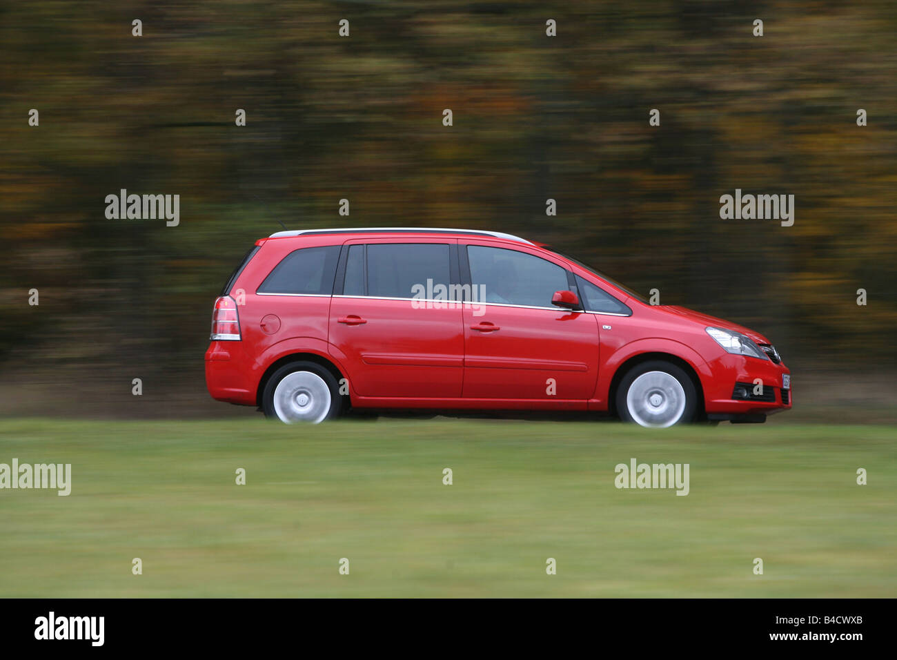 Opel Zafira 1.8 Edition, red, model year 2005-, driving, side view, country road Stock Photo
