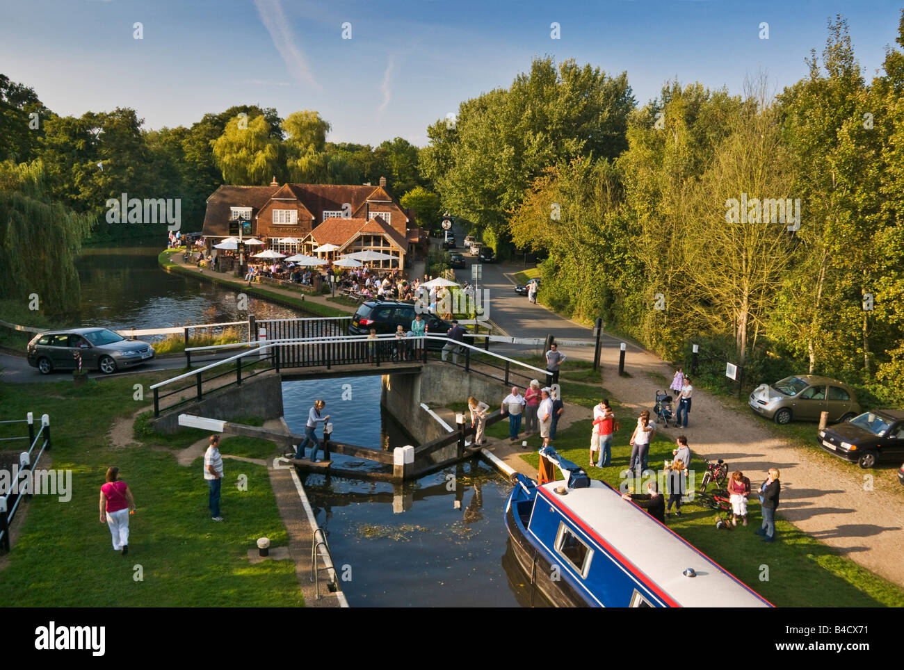 Pyrford Lock on the River Wey Navigation canal with the Anchor Public